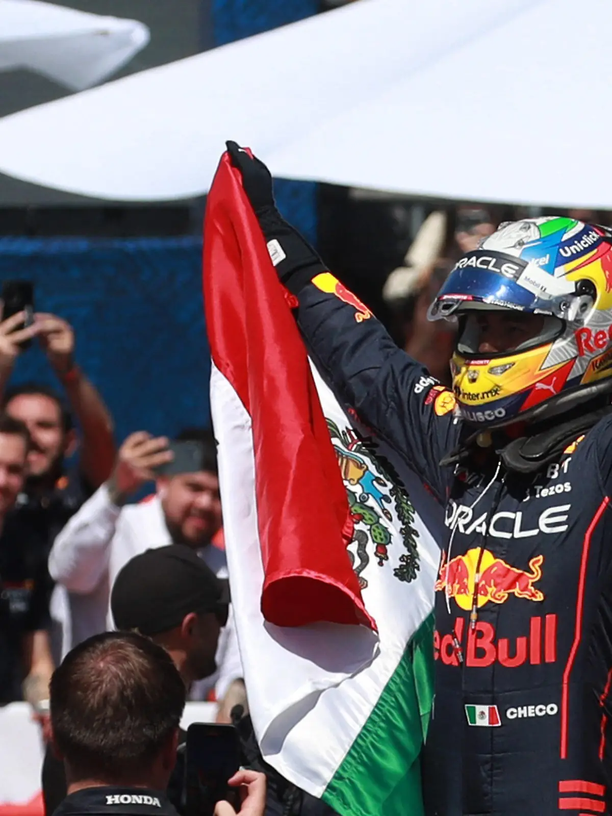 Formula One F1 - Mexico City Grand Prix - Show Run - Guadalajara, Mexico - October 25, 2022 Red Bull's Sergio Perez acknowledges the fans during the show run in the streets of his home town Guadalajara REUTERS/Henry Romero