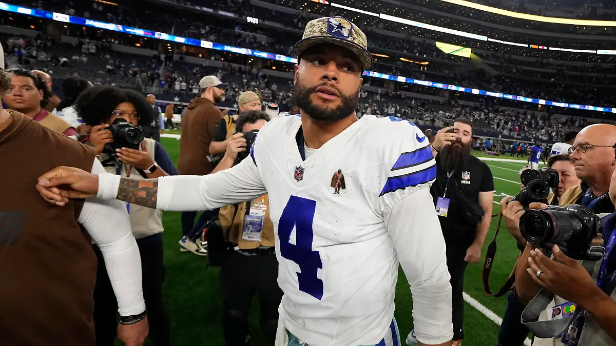 Dallas Cowboys' Dak Prescott (4) walks off the field after an NFL football game against the New York Giants, Sunday, Nov. 12, 2023, in Arlington, Texas. (AP Photo/Julio Cortez)