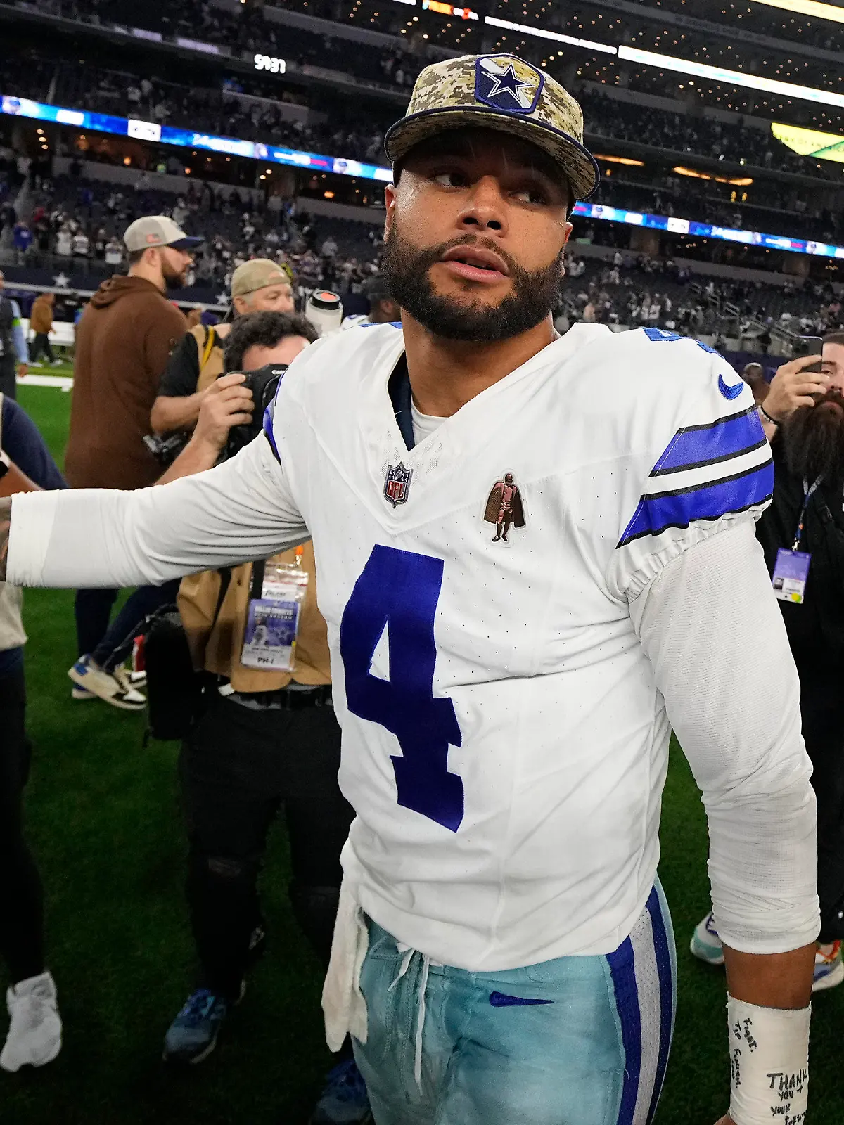 Dallas Cowboys' Dak Prescott (4) walks off the field after an NFL football game against the New York Giants, Sunday, Nov. 12, 2023, in Arlington, Texas. (AP Photo/Julio Cortez)