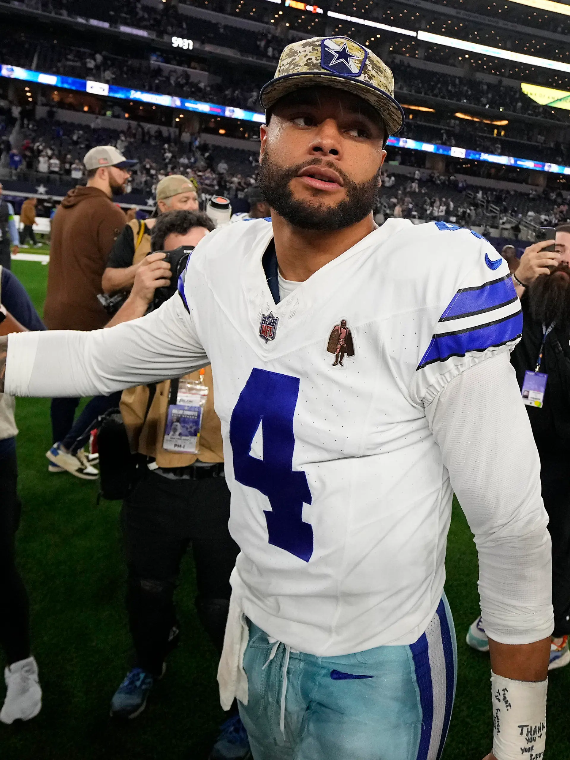Dallas Cowboys' Dak Prescott (4) walks off the field after an NFL football game against the New York Giants, Sunday, Nov. 12, 2023, in Arlington, Texas. (AP Photo/Julio Cortez)