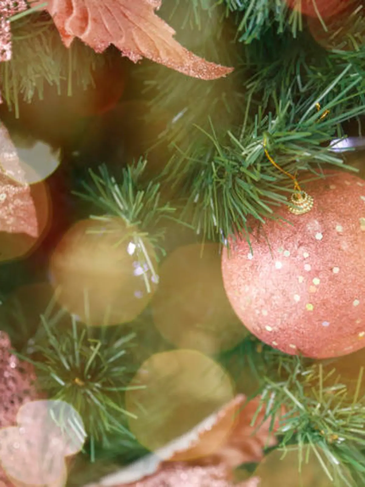 scene background in christmas tree and festive details. Christmas arrangement in pink tones