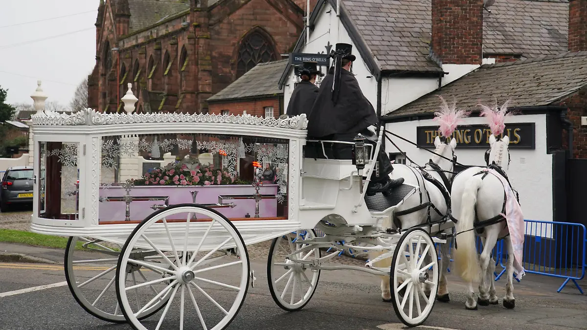 Brianna Ghey funeral. The horse-drawn carriage carrying the coffin of Brianna Ghey arrives for her funeral at Elphin's Parish Church, in Warrington, Cheshire. Brianna was fatally stabbed in Linear Park, Culcheth, Warrington on February 11. Picture date: Wednesday March 15, 2023. See PA story FUNERAL Warrington. Photo credit should read: Peter Byrne/PA Wire URN:71386814