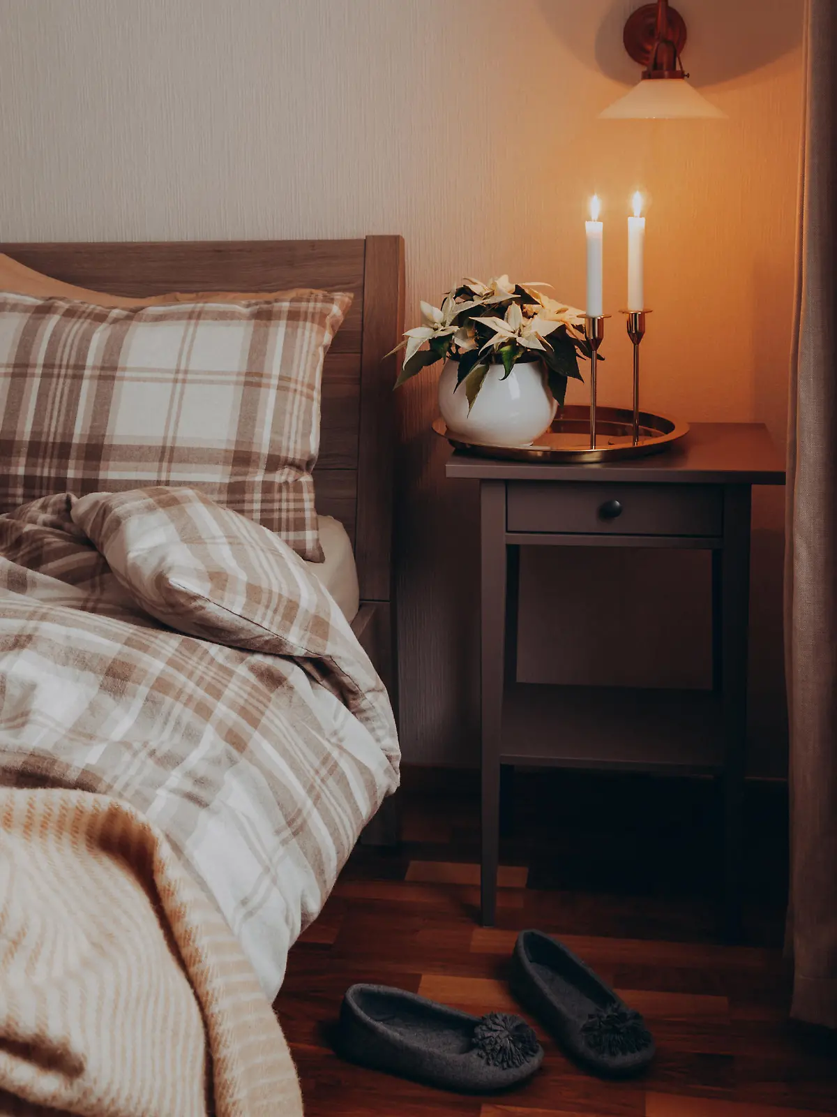 cozy scandinavian bedroom interior in natural tones, blanket candles houseplants