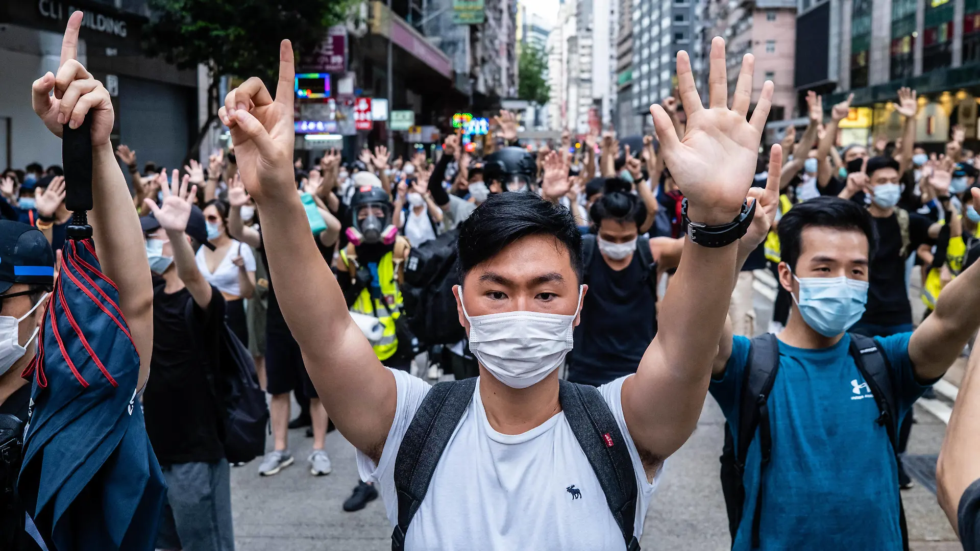 July 1, 2020, Hong Kong, China: Protesters making gestures of 1 and 5 fingers, symbolising the five demands of the protest movement during the demonstration..Following the passing of the National Security Law that would tighten on freedom of expression, Hong Kong protesters marched on the streets to demonstrate. Protesters chanted slogans, sang songs, and obstructed roads. Later, riot police officers arrested several protesters using paintballs and pepper spray. Hong Kong China - ZUMAs197 20200701_zaa_s197_159 Copyright: xWilliexSiawilliexSiaux