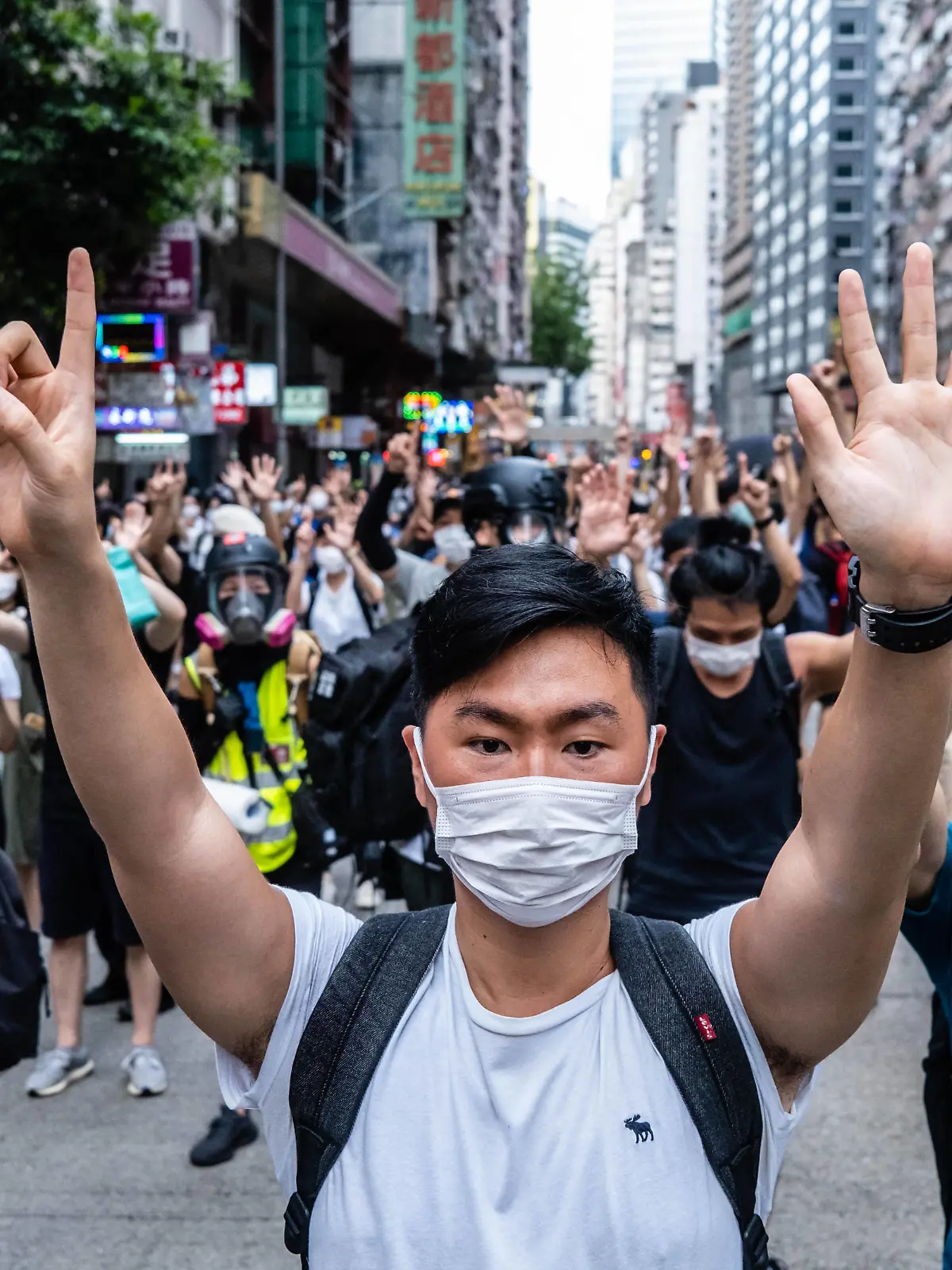 July 1, 2020, Hong Kong, China: Protesters making gestures of 1 and 5 fingers, symbolising the five demands of the protest movement during the demonstration..Following the passing of the National Security Law that would tighten on freedom of expression, Hong Kong protesters marched on the streets to demonstrate. Protesters chanted slogans, sang songs, and obstructed roads. Later, riot police officers arrested several protesters using paintballs and pepper spray. Hong Kong China - ZUMAs197 20200701_zaa_s197_159 Copyright: xWilliexSiawilliexSiaux 