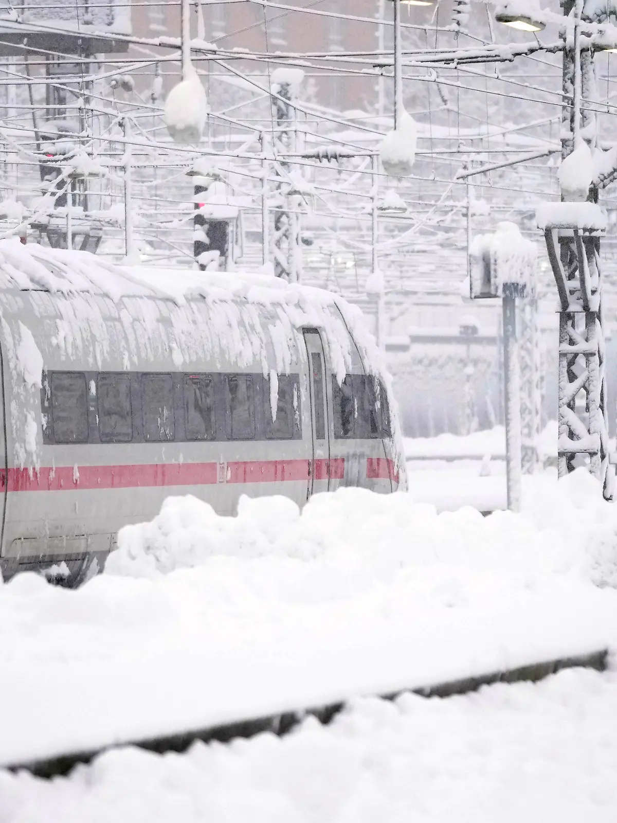 A train is parked at the central station after heavy snow fall in Munich, Germany, Saturday, Dec. 2, 2023. (AP Photo/Matthias Schrader)