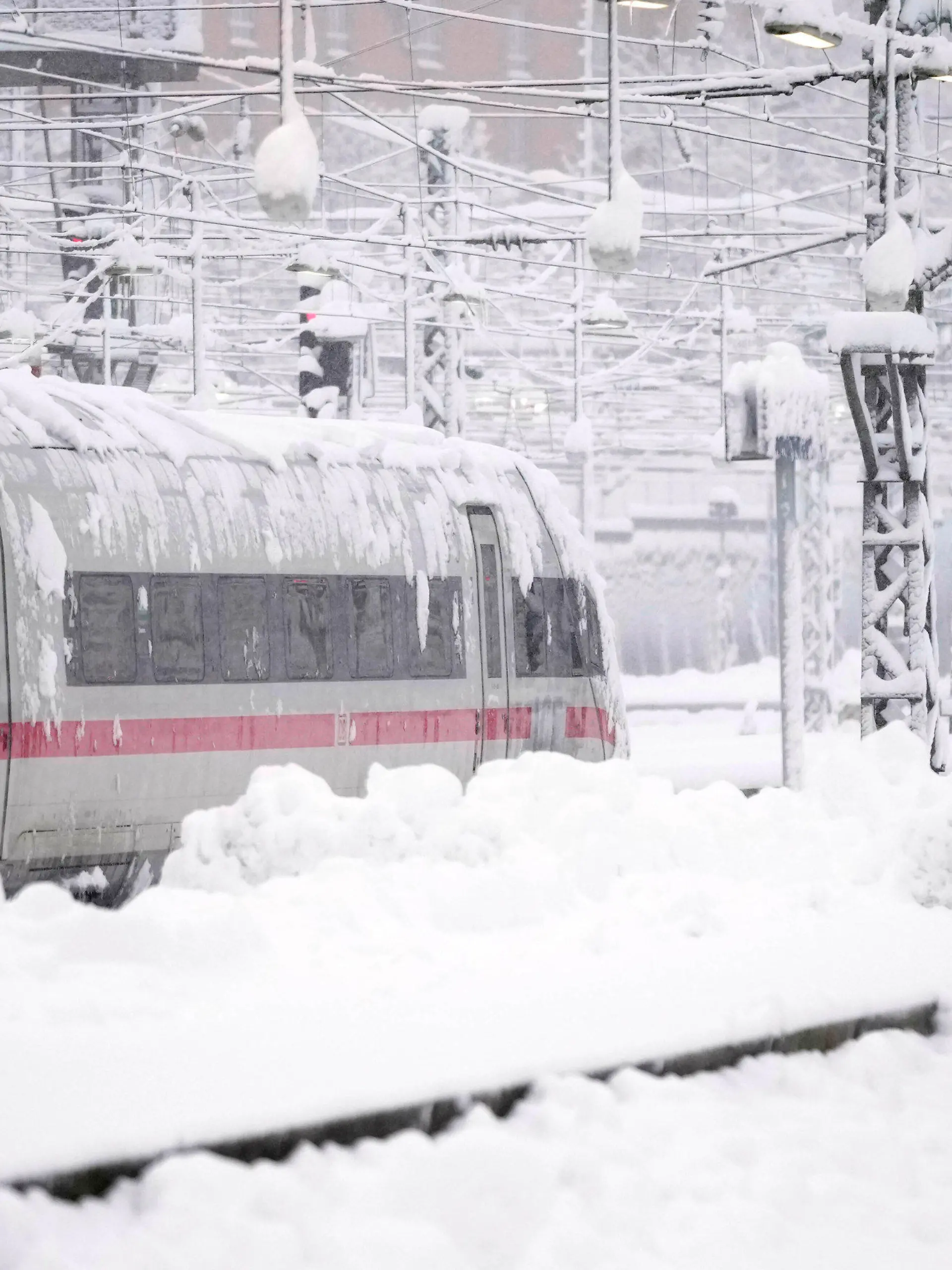 A train is parked at the central station after heavy snow fall in Munich, Germany, Saturday, Dec. 2, 2023. (AP Photo/Matthias Schrader)