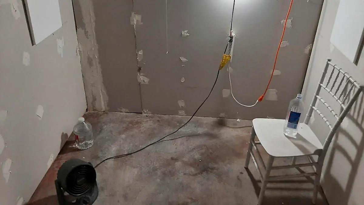 This undated photo provided by the Federal Bureau of Investigation's Portland Field Office shows the interior of a makeshift cinderblock cell in Klamath Falls, Ore., allegedly used by Negasi Zuberi. The FBI said Wednesday, Aug. 2, 2023, that Zuberi, 29, who posed as an undercover police officer kidnapped a woman in Seattle, drove her hundreds of miles to his home in Oregon, and kept her in the cell from which she eventually escaped and found help. Zuberi who was arrested faces a federal interstate kidnapping charge, and authorities said they are looking for additional victims after linking him to sexual assaults in at least four more states. (FBI via AP)