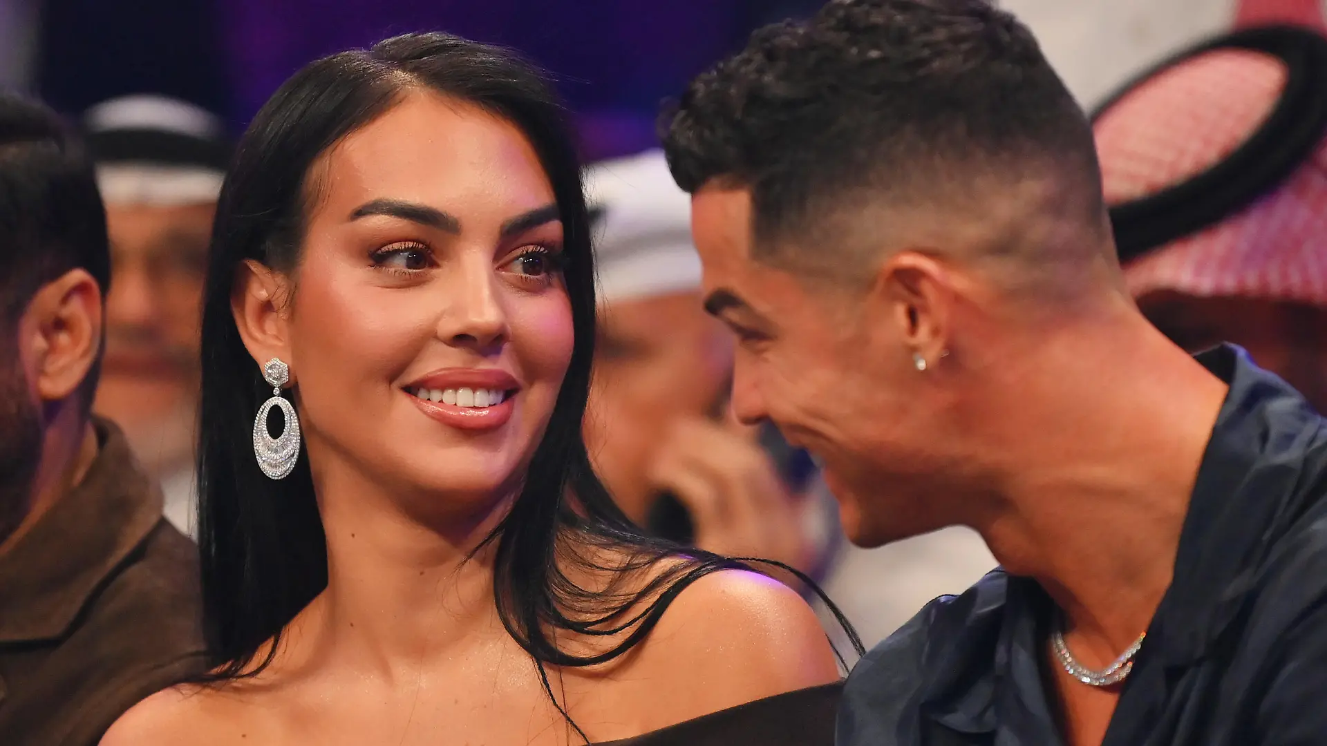 RIYADH, SAUDI ARABIA - OCTOBER 28: Cristiano Ronaldo and his wife Georgina Rodríguez speak ringside prior to the Heavyweight fight between Tyson Fury and Francis Ngannou at Boulevard Hall on October 28, 2023 in Riyadh, Saudi Arabia. (Photo by Justin Setterfield/Getty Images)