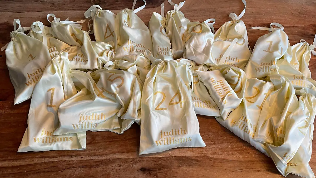24 hellgelbe Beutel mit gold-glitzer Schrift