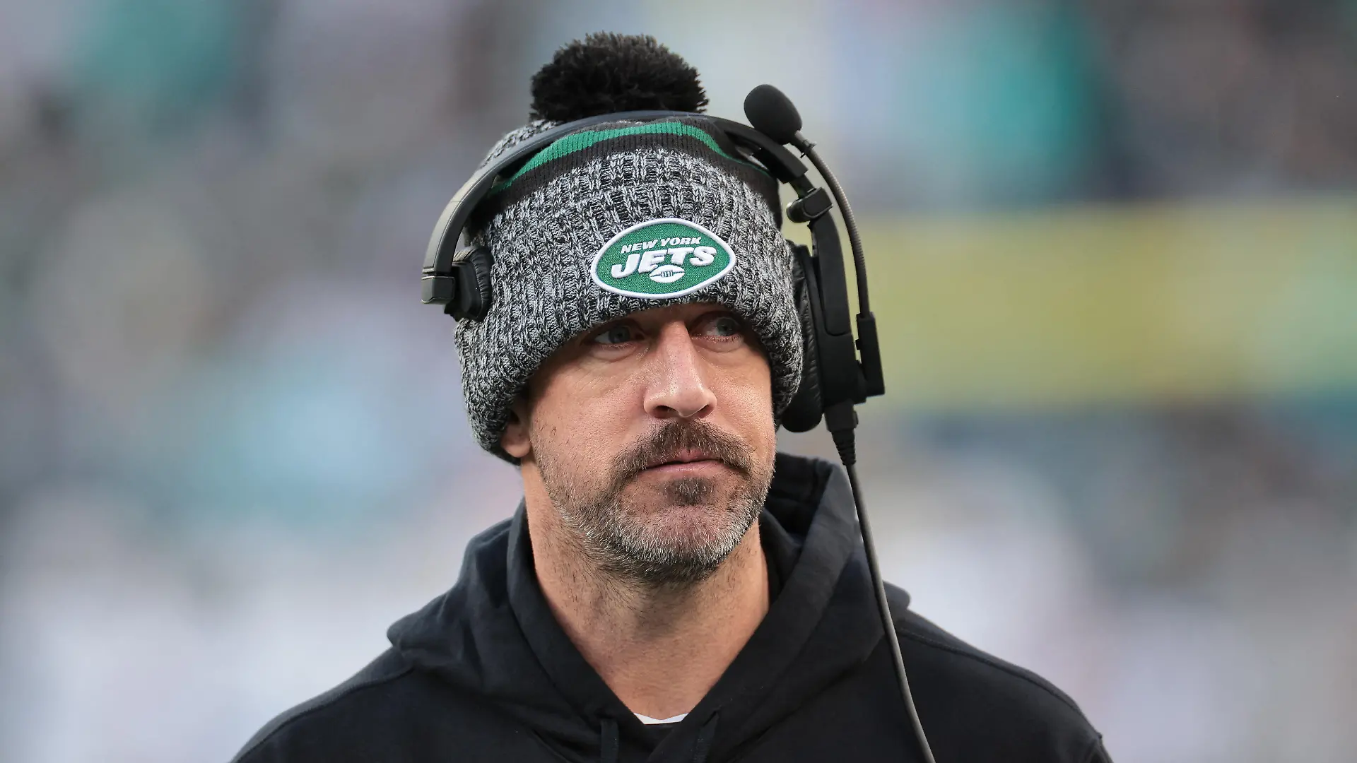 Nov 24, 2023; East Rutherford, New Jersey, USA; New York Jets quarterback Aaron Rodgers (8) on the sidelines during the first half against the Miami Dolphins at MetLife Stadium. Mandatory Credit: Vincent Carchietta-USA TODAY Sports