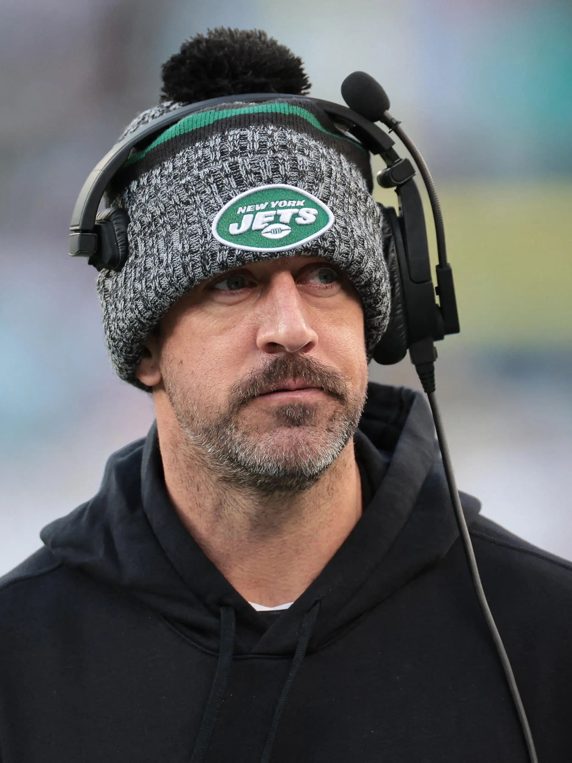 Nov 24, 2023; East Rutherford, New Jersey, USA; New York Jets quarterback Aaron Rodgers (8) on the sidelines during the first half against the Miami Dolphins at MetLife Stadium. Mandatory Credit: Vincent Carchietta-USA TODAY Sports