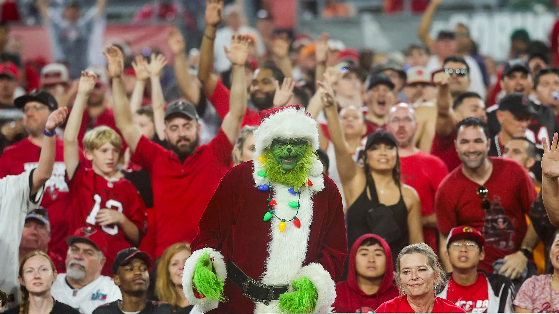 Dec 3, 2023; Tampa, Florida, USA; fans react to a Tampa Bay Buccaneers touchdown against the Carolina Panthers in the third quarter at Raymond James Stadium. Mandatory Credit: Nathan Ray Seebeck-USA TODAY Sports