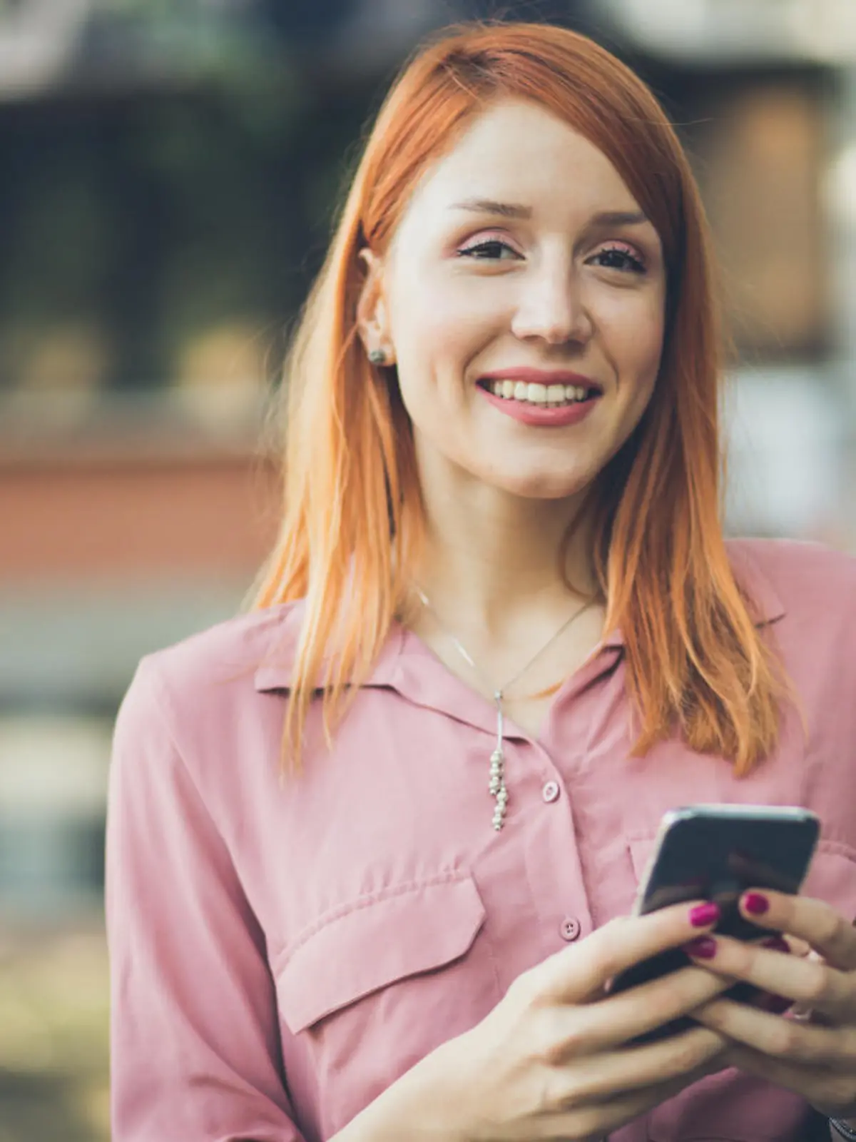 It's easier with the technology. Business woman using phone on street. Close up