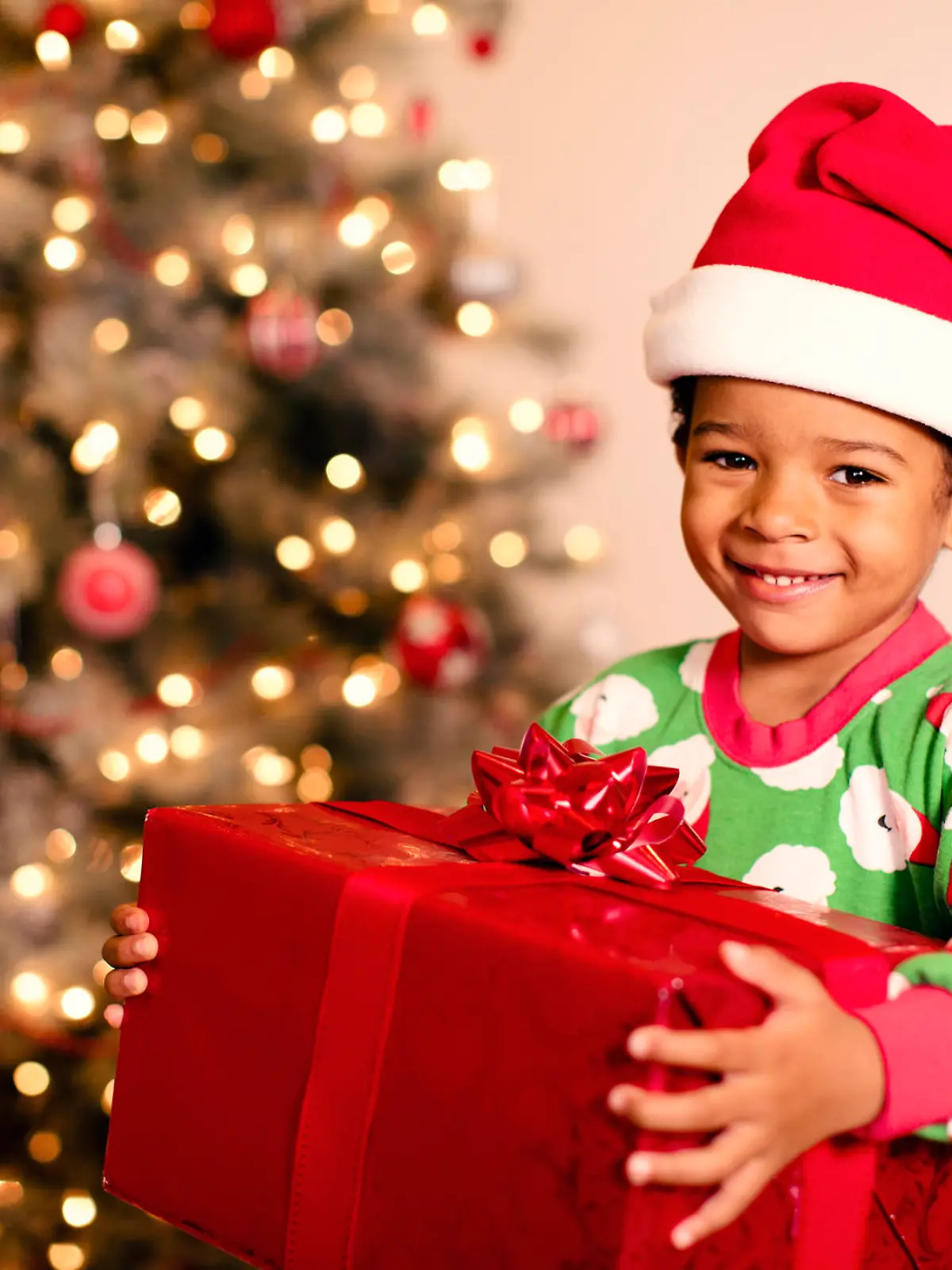 A young boy is excited for Christmas morning and the opening of presents.