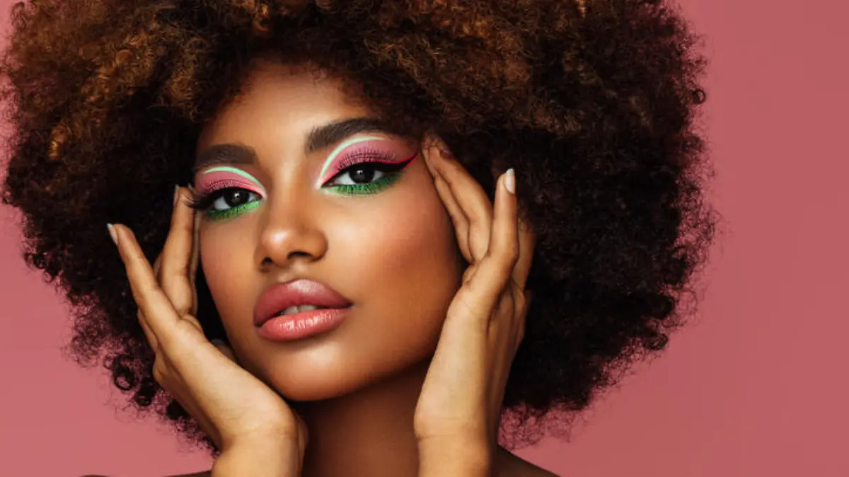 Portrait of young afro woman with bright make-up