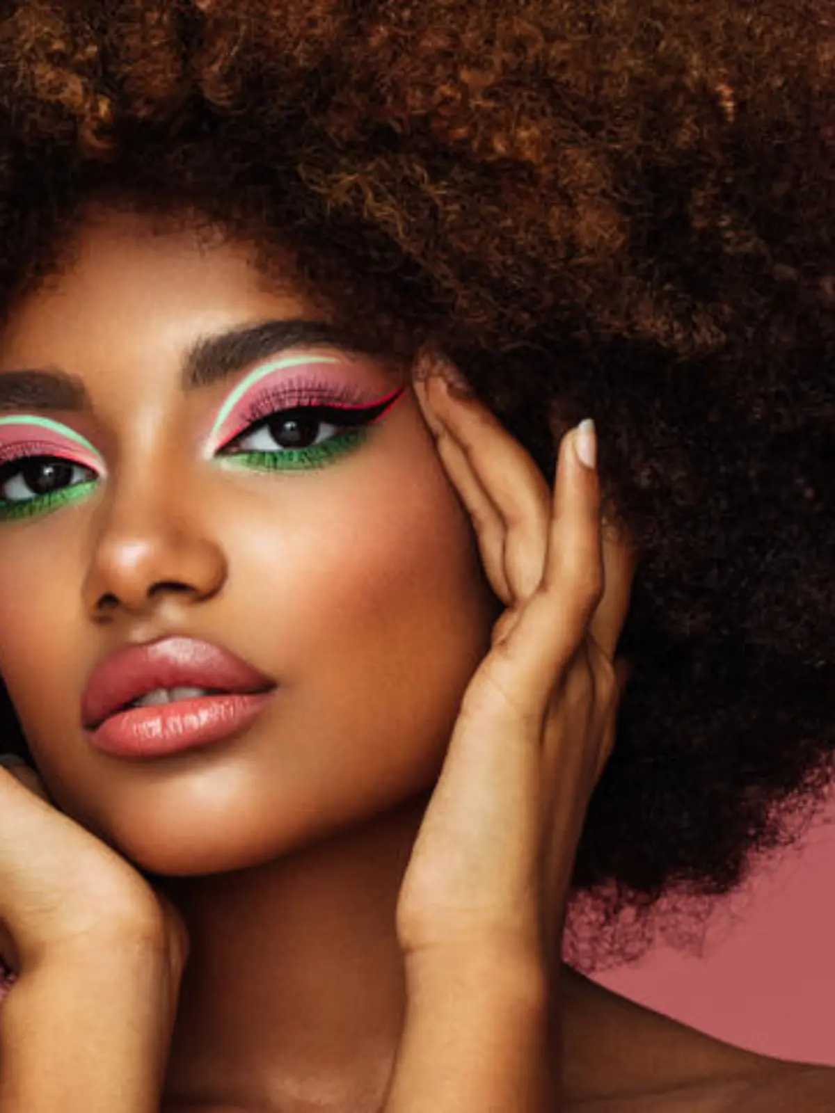 Portrait of young afro woman with bright make-up