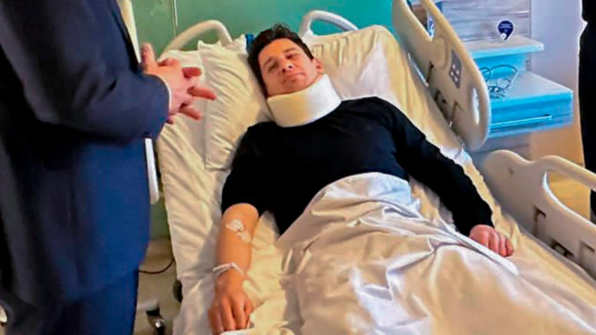 In this handout photo released by Turkish Interior Ministry, Turkish referee Halil Umut Meler, center, rests in a bed as he talks to Turkish Interior Minister Ali Yerlikaya, third left, at Acibadem hospital in Ankara, Tuesday, Dec. 12, 2023. The Turkish Football Federation has suspended all league games in the country after a club president punched the referee in the face at the end of a top-flight match. (Turkish Interior Ministry via AP)