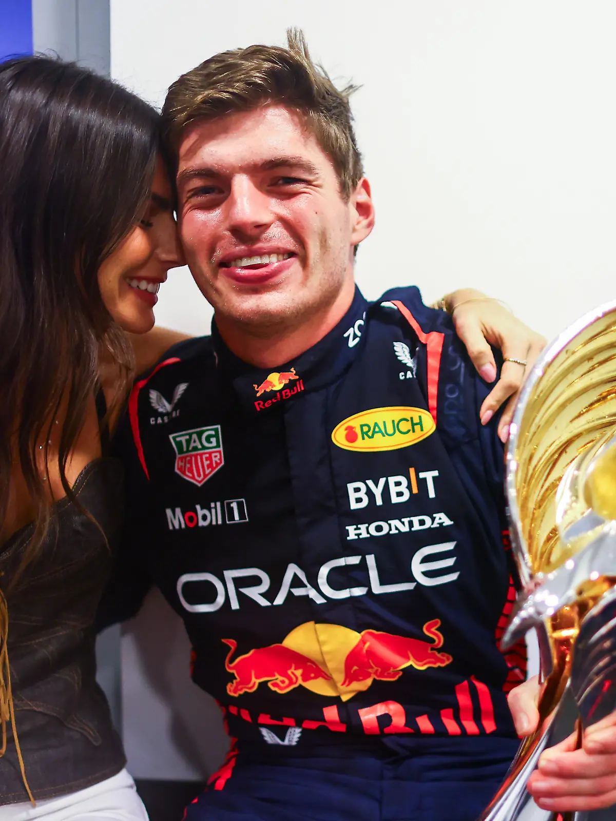 ABU DHABI, UNITED ARAB EMIRATES - NOVEMBER 26: Race winner Max Verstappen of the Netherlands and Oracle Red Bull Racing and Kelly Piquet pose for a photo after the F1 Grand Prix of Abu Dhabi at Yas Marina Circuit on November 26, 2023 in Abu Dhabi, United Arab Emirates. (Photo by Mark Thompson/Getty Images)