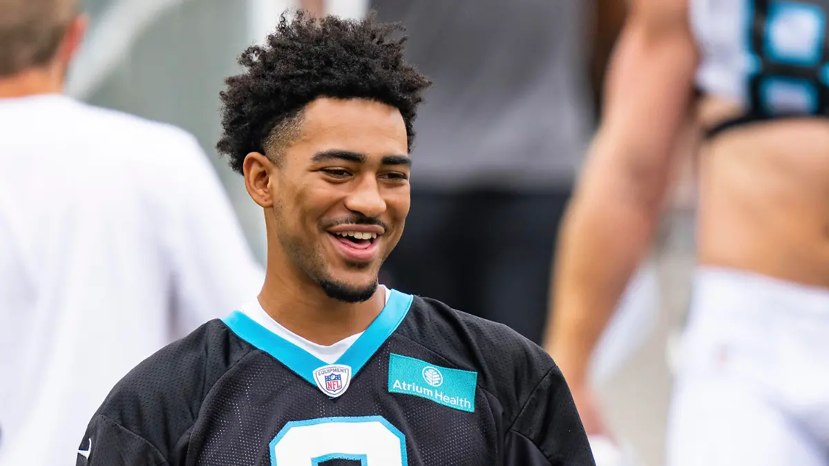 Carolina Panthers quarterback Bryce Young walks onto the field at the NFL football team's training camp on Saturday, July 29, 2023, in Spartanburg, S.C. (AP Photo/Jacob Kupferman)