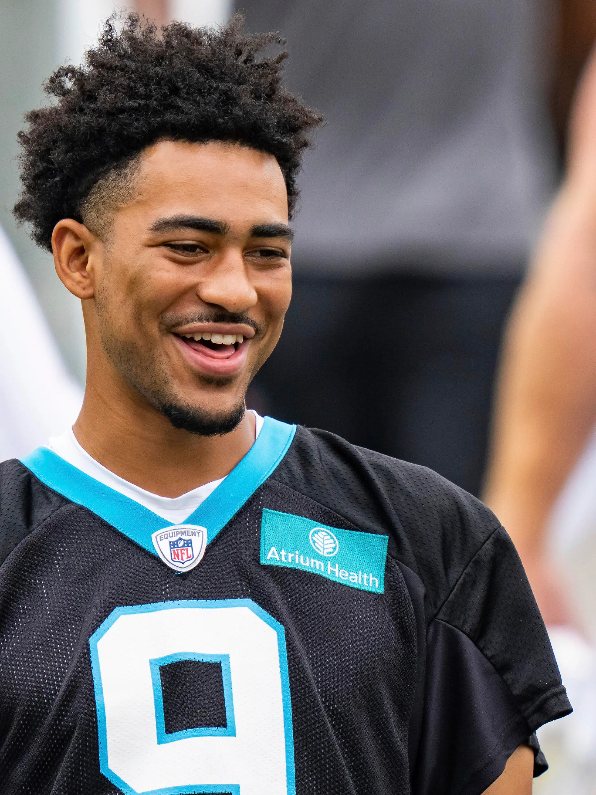 Carolina Panthers quarterback Bryce Young walks onto the field at the NFL football team's training camp on Saturday, July 29, 2023, in Spartanburg, S.C. (AP Photo/Jacob Kupferman)