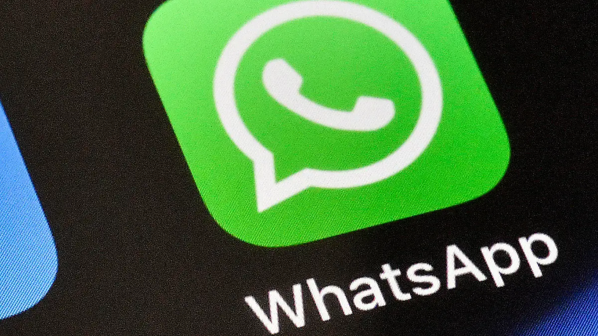 FILE - A WhatsApp icon is displayed on an iPhone, Thursday, Nov. 15, 2018 in Gelsenkirchen, Germany. WhatsApp has chosen the Mercedes Formula One team for its first sports sponsorship, a multi-year agreement that will give followers of the eight-time world champion exclusive team content and in-race updates through the Meta-owned private messaging service.  (AP Photo/Martin Meissner, File)