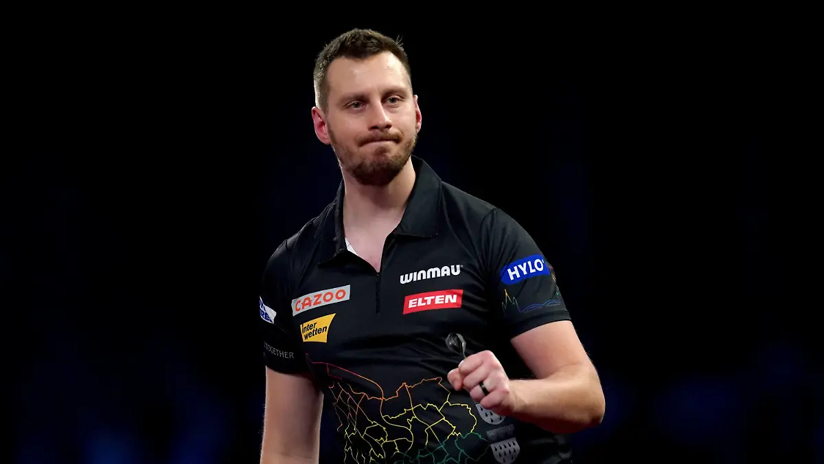 ARCHIV - 22.12.2022, Großbritannien, London: Darts: WM, Tag 8; 2. Runde, Hempel (Deutschland) gegen Humphries (England); Cazoo World Darts Championship im Alexandra Palace: Florian Hempel jubelt während seines Spiels. Hempel startet am Sonntag in die WM. (zu dpa: ««Schulnote fünf minus bis sechs»: Hempel vor WM selbstkritisch») Foto: John Walton/Press Association/dpa +++ dpa-Bildfunk +++
