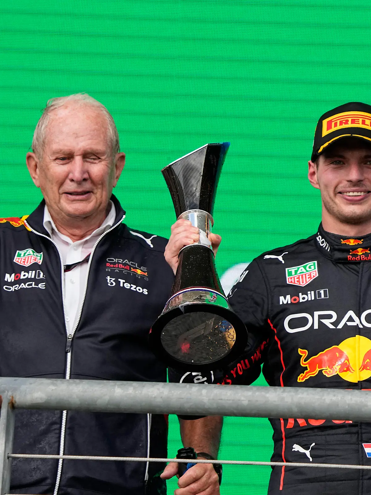 Red Bull driver Max Verstappen, of the Netherlands, right, and Helmut Marko, left, head of Red Bull Motorsports, pose with trophies after the Formula One U.S. Grand Prix auto race at the Circuit of the Americas, Sunday, Oct. 23, 2022, in Austin, Texas. (AP Photo/Charlie Neibergall)
