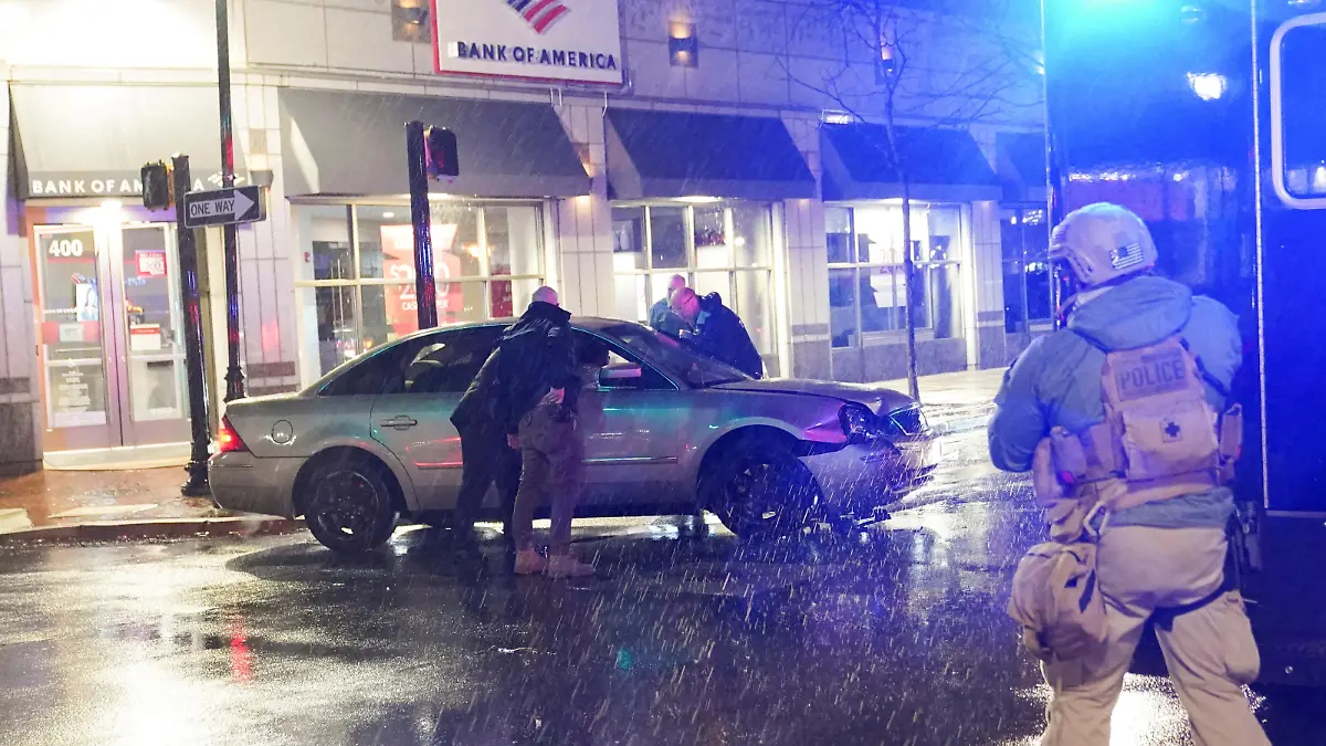 Members of the United States Secret Service react to a vehicle crashing into a Secret Service SUV that was blocking the street as U.S. President Joe Biden exited his campaign headquarters, in Wilmington, Delaware, U.S. December 17, 2023. REUTERS/Nathan Howard TPX IMAGES OF THE DAY REFILE - CORRECTING LOCATION FROM "NORTH CAROLINA" TO "DELAWARE\