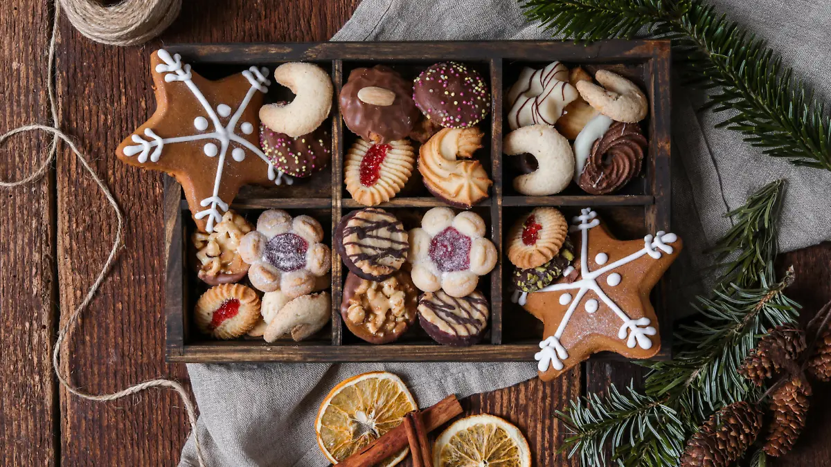 christmas cookie box with gingerbread in rustic wood kitchen