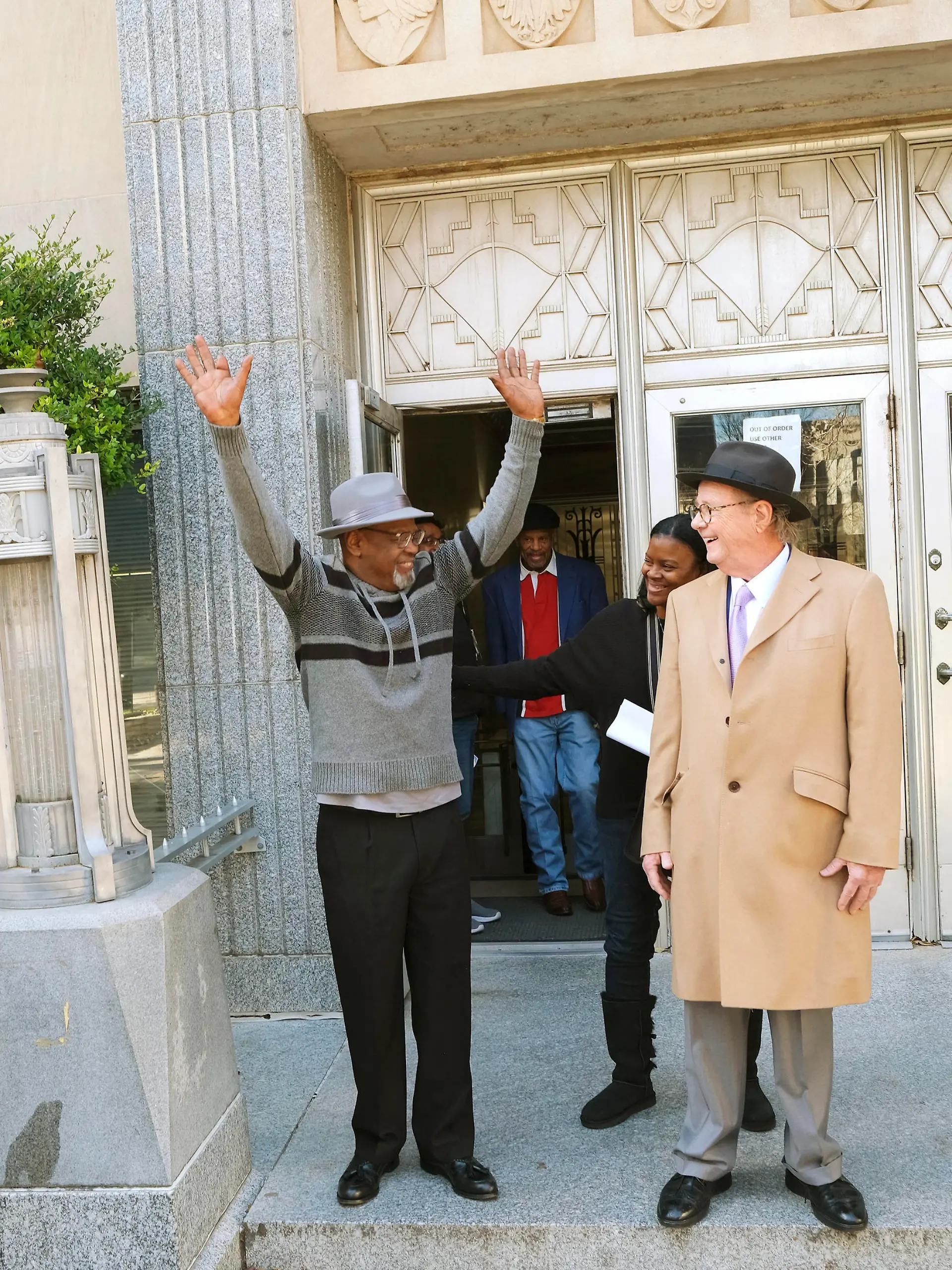 Glynn Simmons reacts after stepping out of the courthouse after Judge Amy Palumbo ruled to approve his "actual innocence" claim during a hearing at the Oklahoma County Courthouse Tuesday, Dec. 19, 2023, in Oklahoma City, Okla. (Doug Hoke/The Oklahoman via AP)