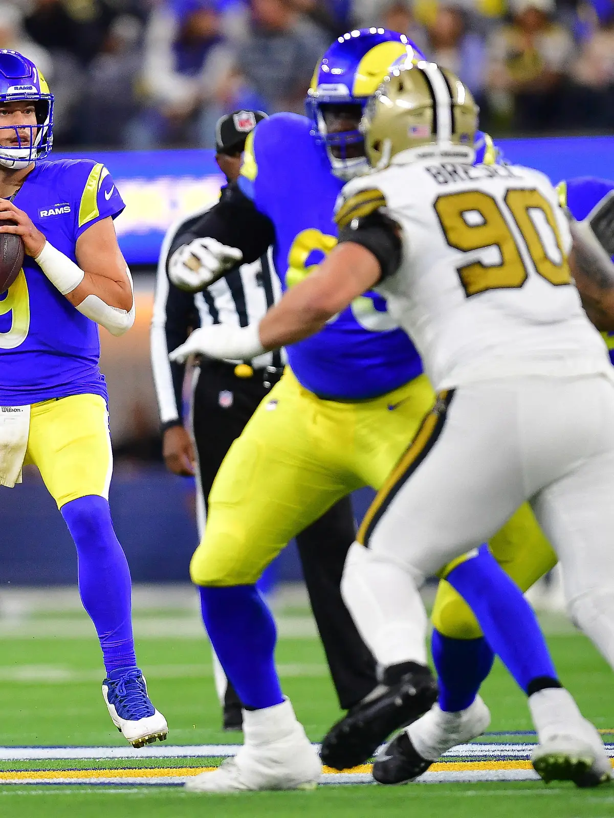 Dec 21, 2023; Inglewood, California, USA; Los Angeles Rams quarterback Matthew Stafford (9) drops back to pass against the New Orleans Saints during the first half at SoFi Stadium. Mandatory Credit: Gary A. Vasquez-USA TODAY Sports