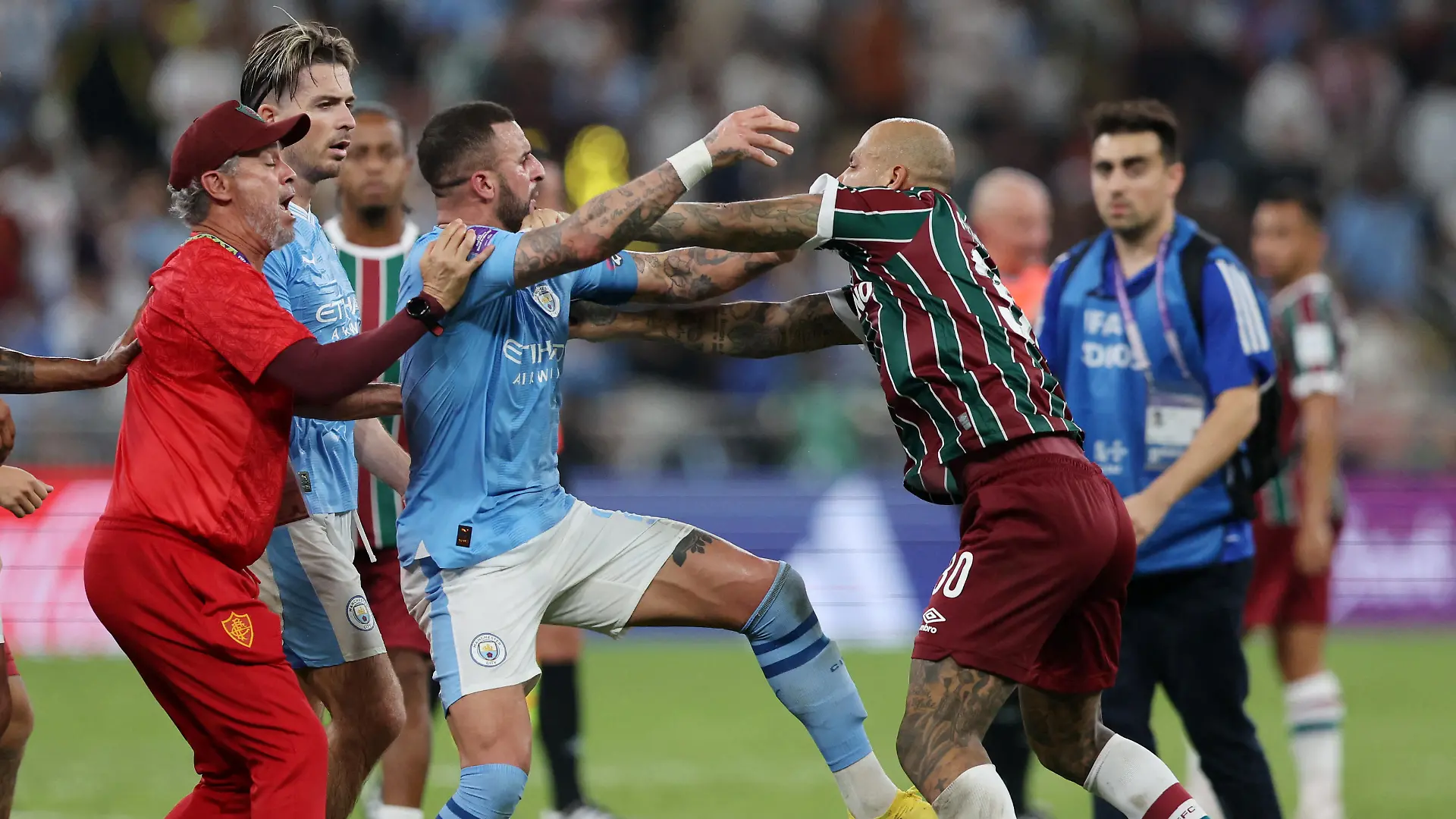 Soccer Football - Club World Cup - Final - Manchester City v Fluminense - King Abdullah Sports City, Jeddah, Saudi Arabia - December 22, 2023 Manchester City's Kyle Walker clashes with Fluminense's Felipe Melo after the match REUTERS/Amr Abdallah Dalsh