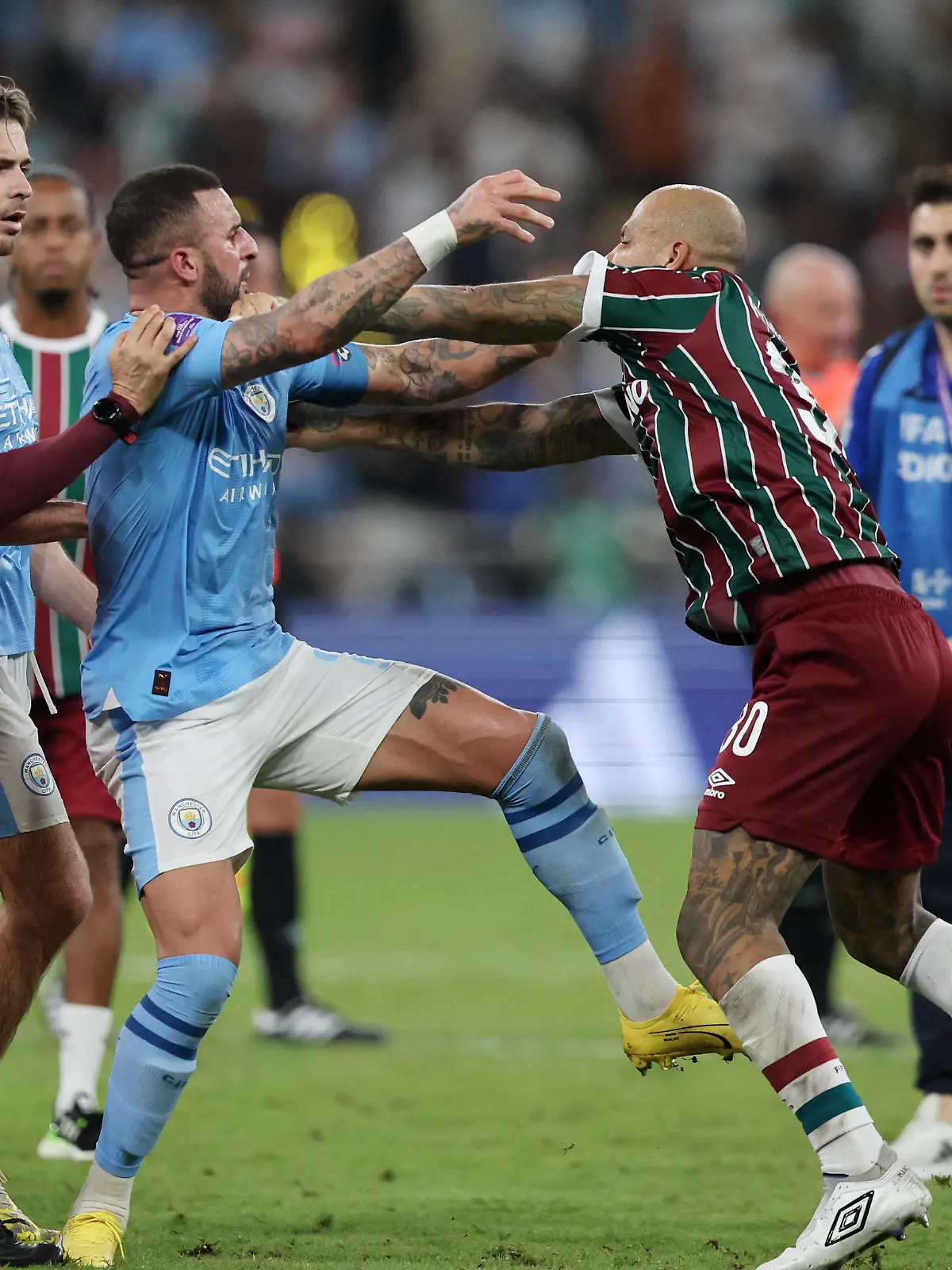 Soccer Football - Club World Cup - Final - Manchester City v Fluminense - King Abdullah Sports City, Jeddah, Saudi Arabia - December 22, 2023 Manchester City's Kyle Walker clashes with Fluminense's Felipe Melo after the match REUTERS/Amr Abdallah Dalsh