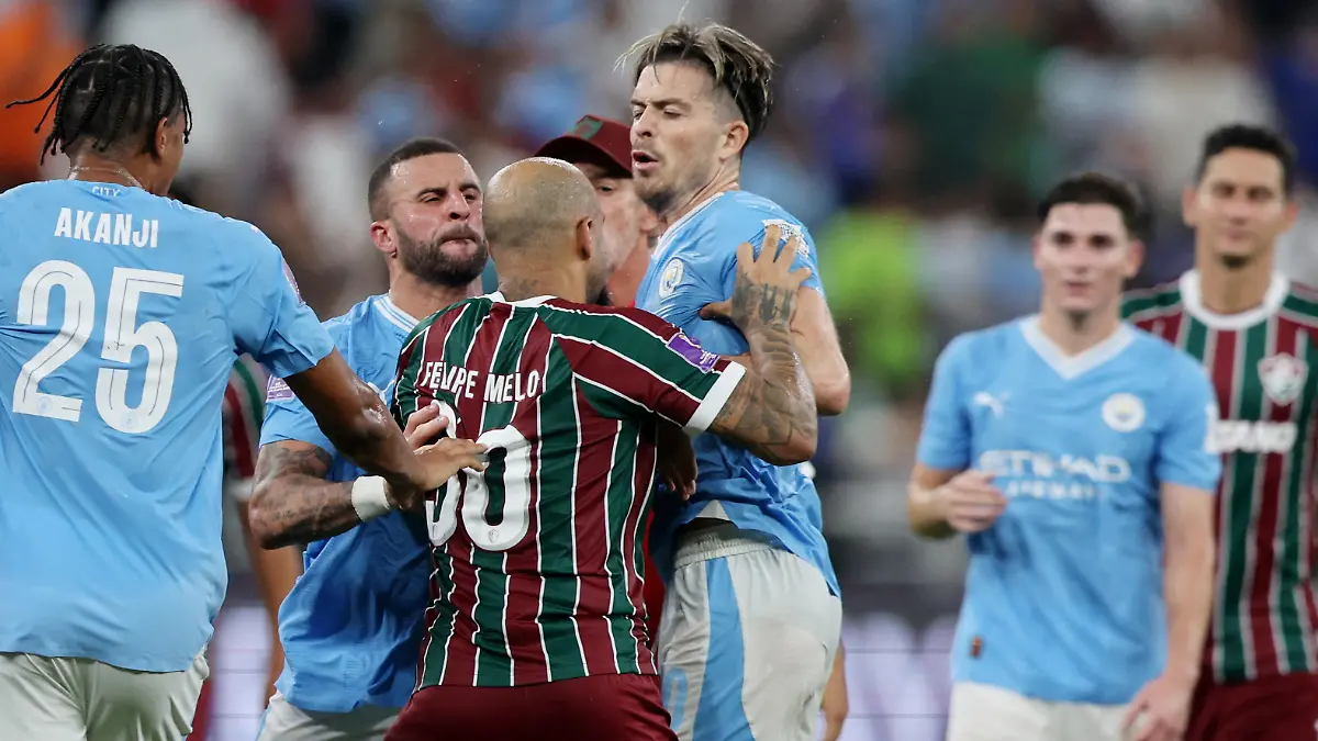 Soccer Football - Club World Cup - Final - Manchester City v Fluminense - King Abdullah Sports City, Jeddah, Saudi Arabia - December 22, 2023 Manchester City's Kyle Walker and Jack Grealish clash with Fluminense's Felipe Melo after the match REUTERS/Amr Abdallah Dalsh