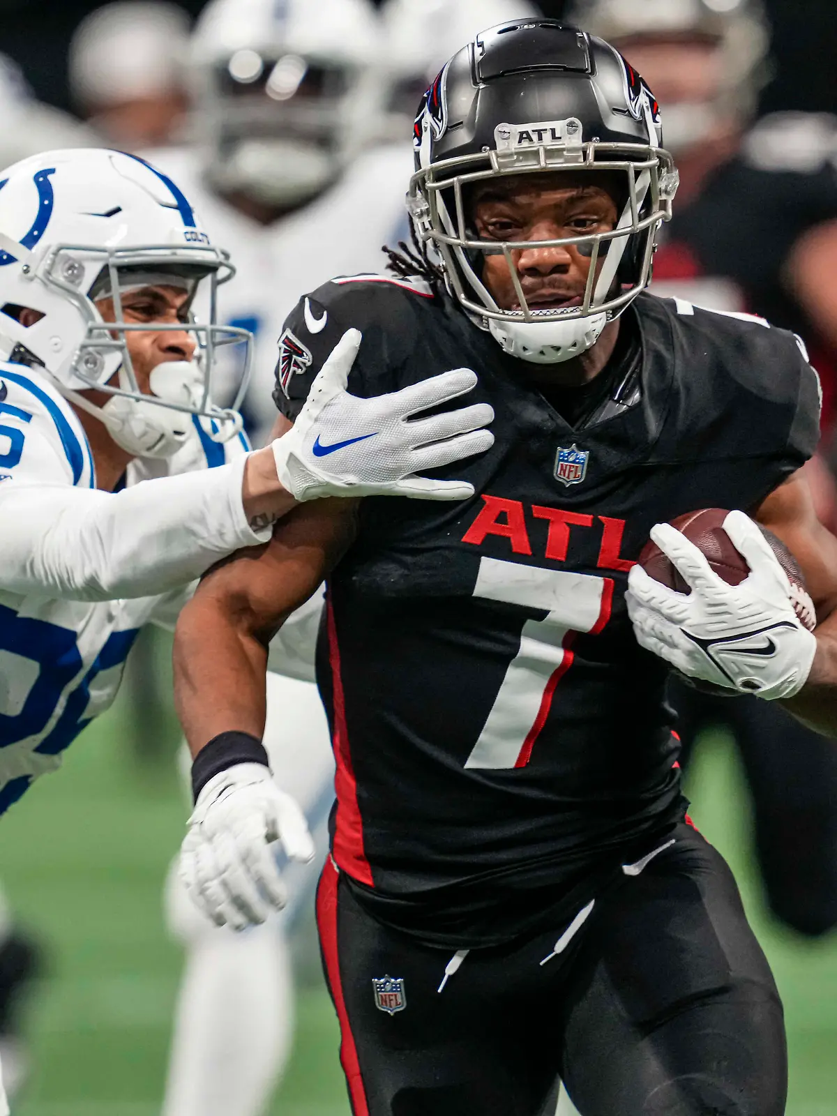 Dec 24, 2023; Atlanta, Georgia, USA; Atlanta Falcons running back Bijan Robinson (7) runs against Indianapolis Colts safety Rodney Thomas II (25) during the first quarter at Mercedes-Benz Stadium. Mandatory Credit: Dale Zanine-USA TODAY Sports