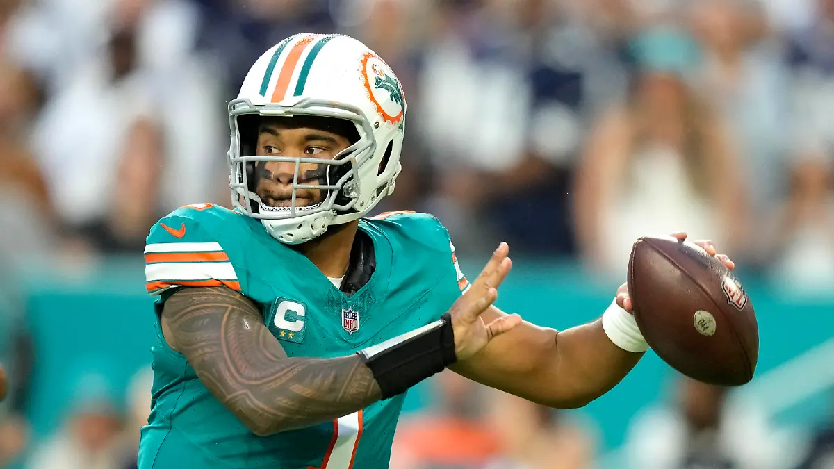 Miami Dolphins quarterback Tua Tagovailoa (1) looks to pass during the first half of an NFL football game against the Dallas Cowboys, Sunday, Dec. 24, 2023, in Miami Gardens, Fla. (AP Photo/Rebecca Blackwell )