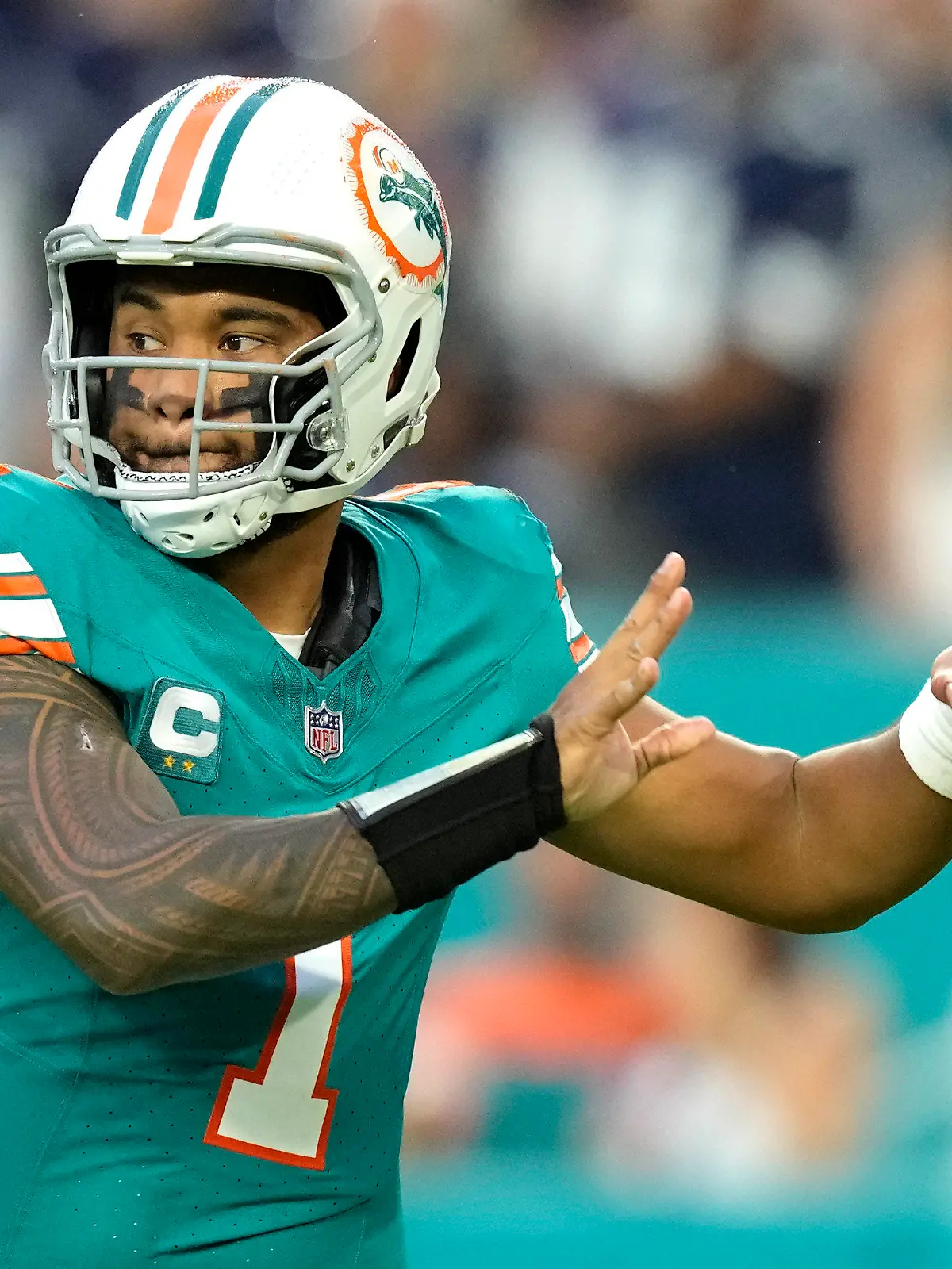 Miami Dolphins quarterback Tua Tagovailoa (1) looks to pass during the first half of an NFL football game against the Dallas Cowboys, Sunday, Dec. 24, 2023, in Miami Gardens, Fla. (AP Photo/Rebecca Blackwell )