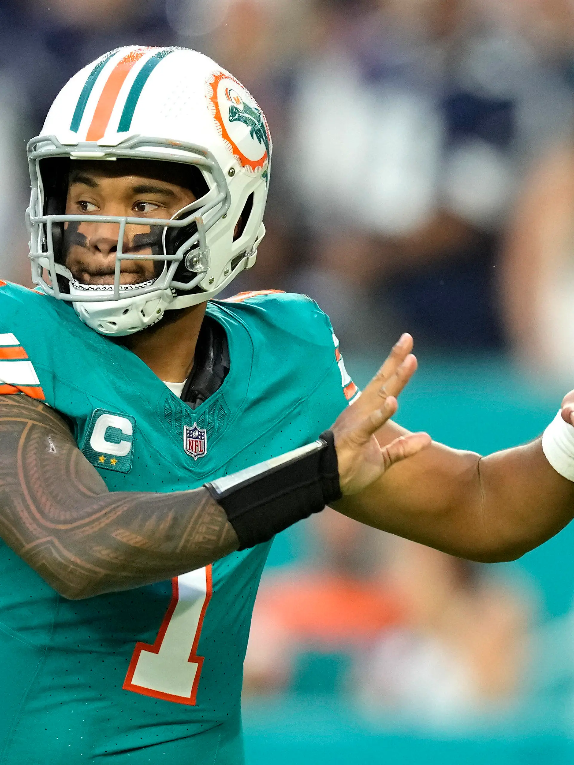 Miami Dolphins quarterback Tua Tagovailoa (1) looks to pass during the first half of an NFL football game against the Dallas Cowboys, Sunday, Dec. 24, 2023, in Miami Gardens, Fla. (AP Photo/Rebecca Blackwell )