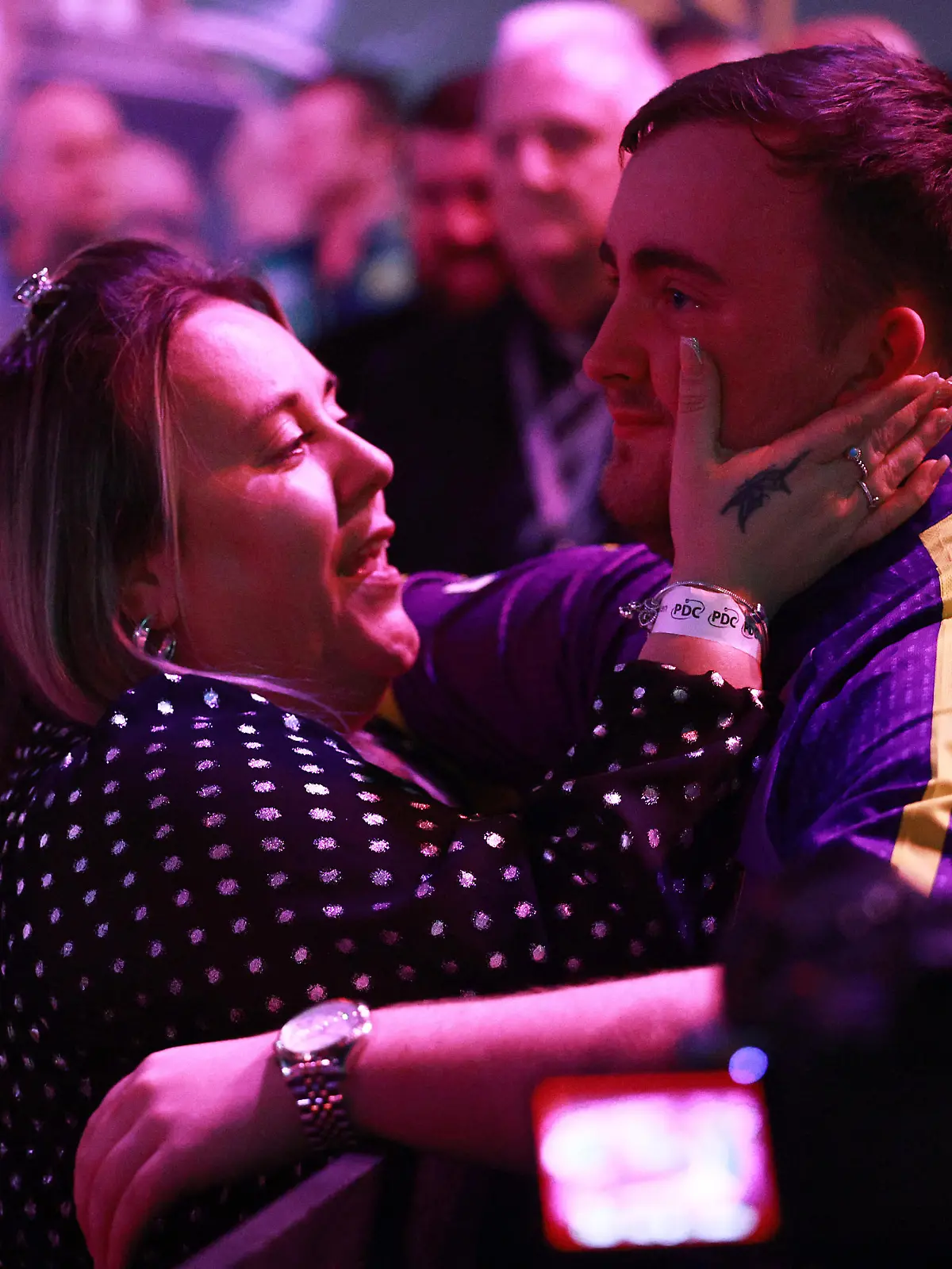LONDON, ENGLAND - DECEMBER 27: Luke Littler of England celebrates victory against Matt Campbell of Canada with family during Day Ten of the 2023/24 Paddy Power World Darts Championship at Alexandra Palace on December 27, 2023 in London, England. (Photo by Warren Little/Getty Images)