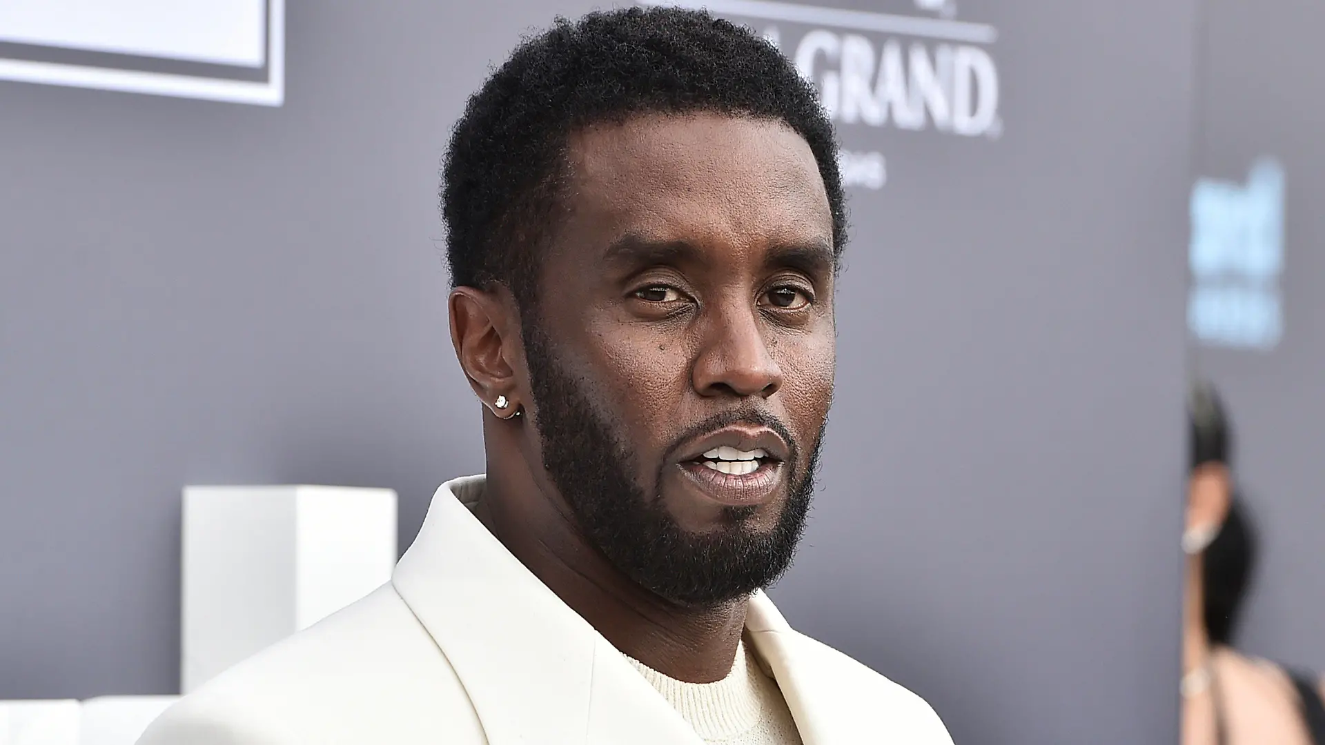 FILE - Music mogul and entrepreneur Sean "Diddy" Combs arrives at the Billboard Music Awards, May 15, 2022, in Las Vegas. A woman sued the hip-hop mogul on Wednesday, Dec. 6, 2023, claiming he and two other men raped her 20 years ago in a New York City recording studio when she was 17. The woman, whose name wasn’t disclosed in the court filing, is the fourth person to file a lawsuit accusing Combs of sexual assault in recent weeks. (Photo by Jordan Strauss/Invision/AP, File)