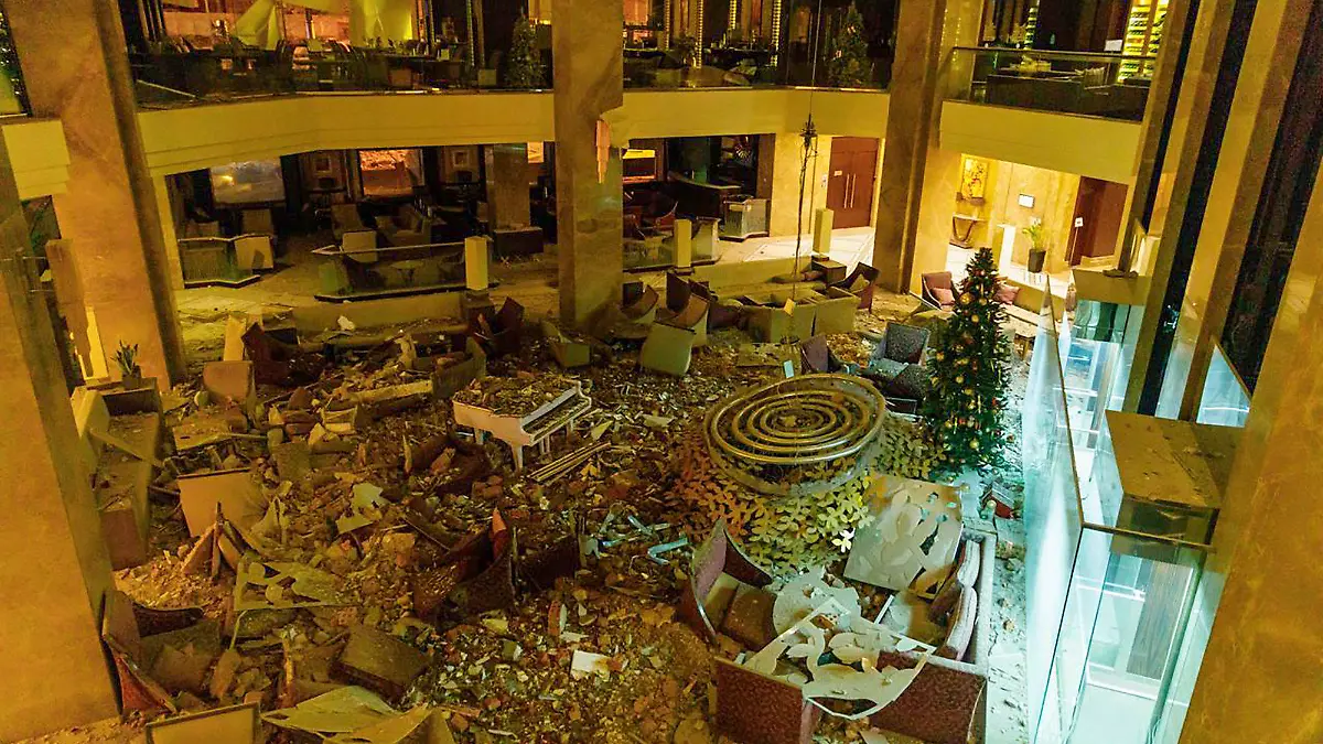 In this photo provided by Kharkiv Regional Administration, the ruined lobby of Kharkiv Palace Hotel is seen after Russia's missile attack in Kharkiv, Ukraine, Sunday, Dec. 31, 2023. (Kharkiv Regional Administration via AP)