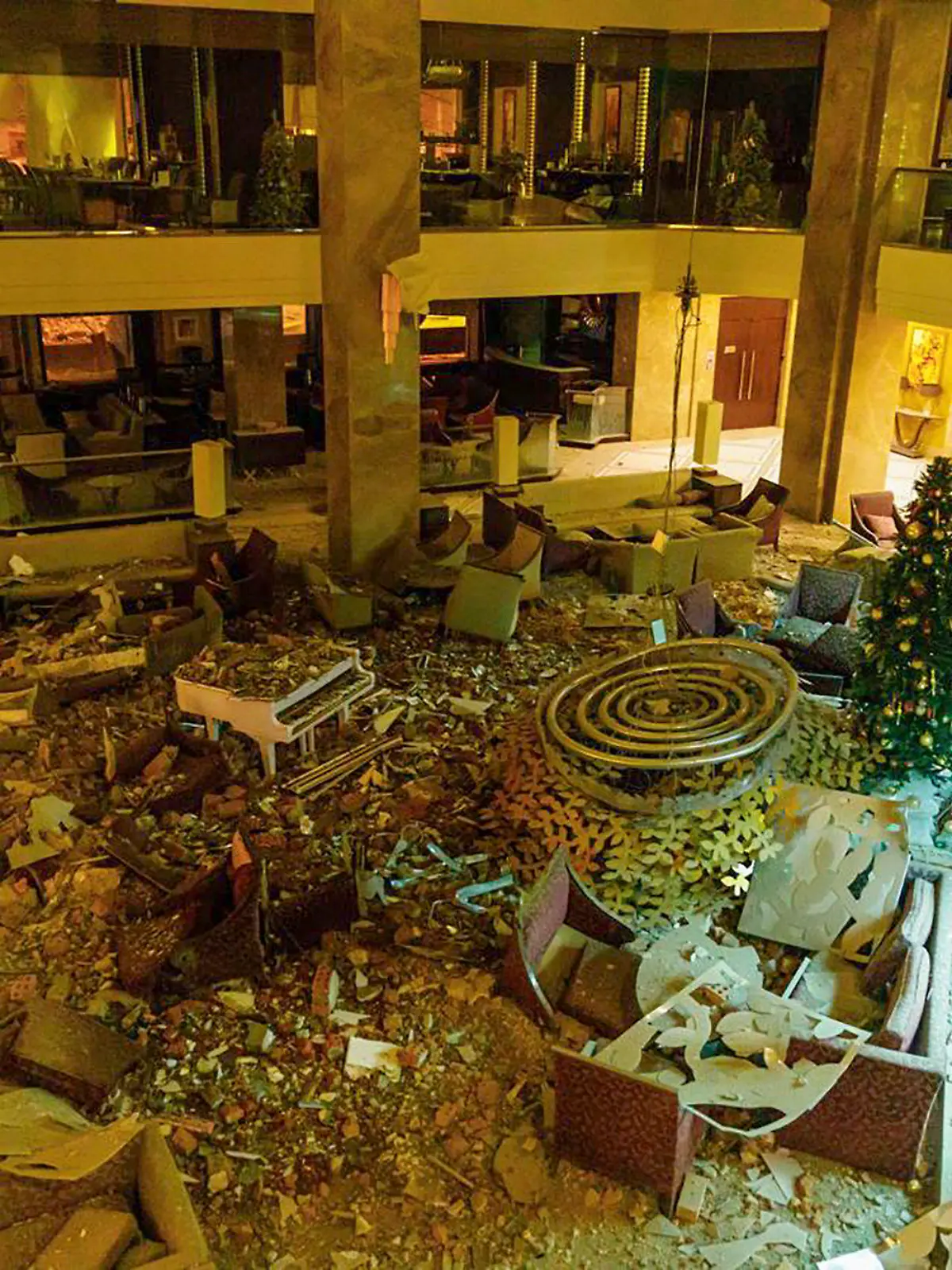In this photo provided by Kharkiv Regional Administration, the ruined lobby of Kharkiv Palace Hotel is seen after Russia's missile attack in Kharkiv, Ukraine, Sunday, Dec. 31, 2023. (Kharkiv Regional Administration via AP)