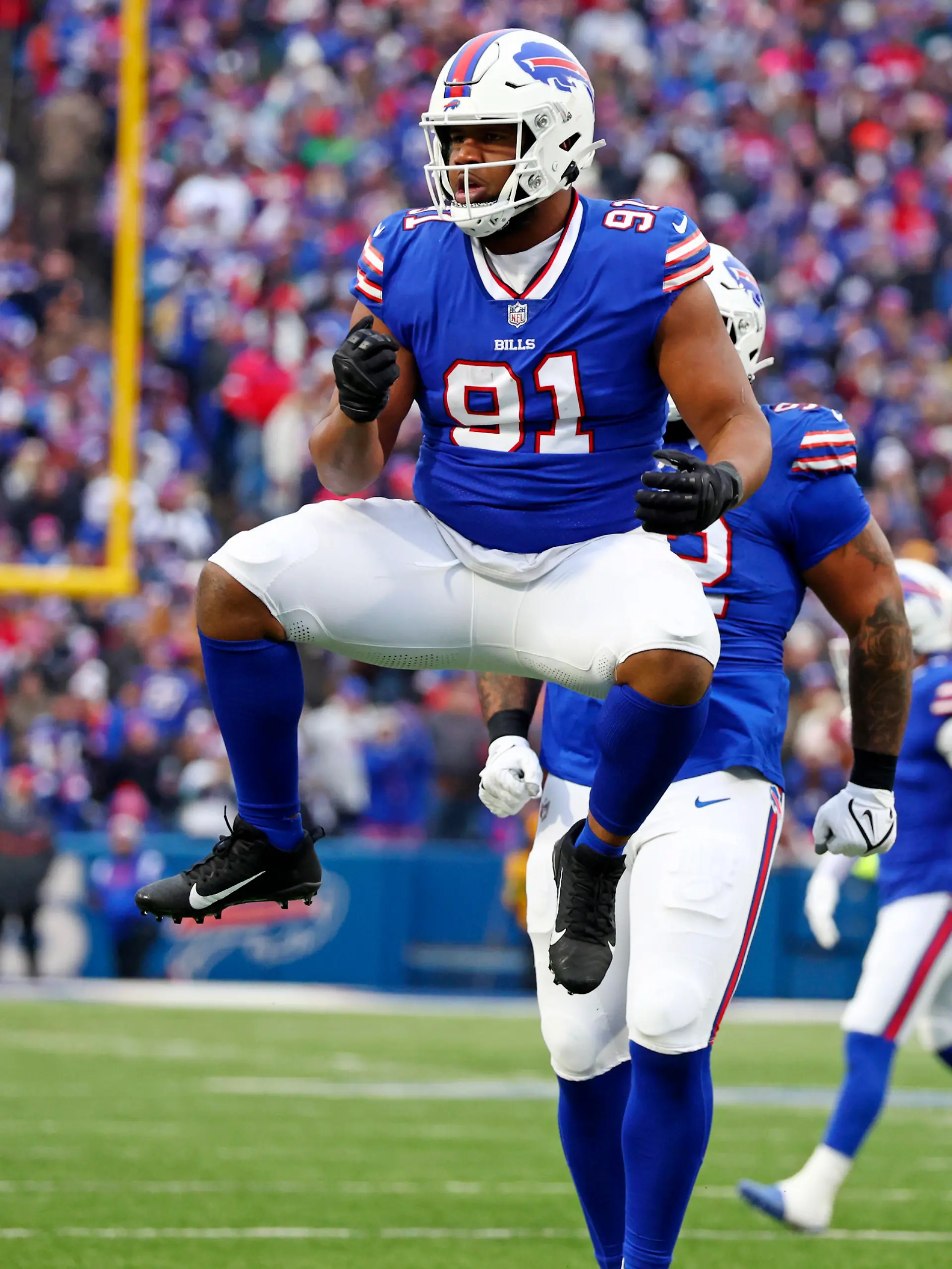 Buffalo Bills defensive tackle Ed Oliver (91) celebrates sacking New England Patriots quarterback Bailey Zappe (4), not pictured, during the first half of an NFL football game in Orchard Park, N.Y., Sunday, Dec. 31, 2023. (AP Photo/Jeffrey T. Barnes )