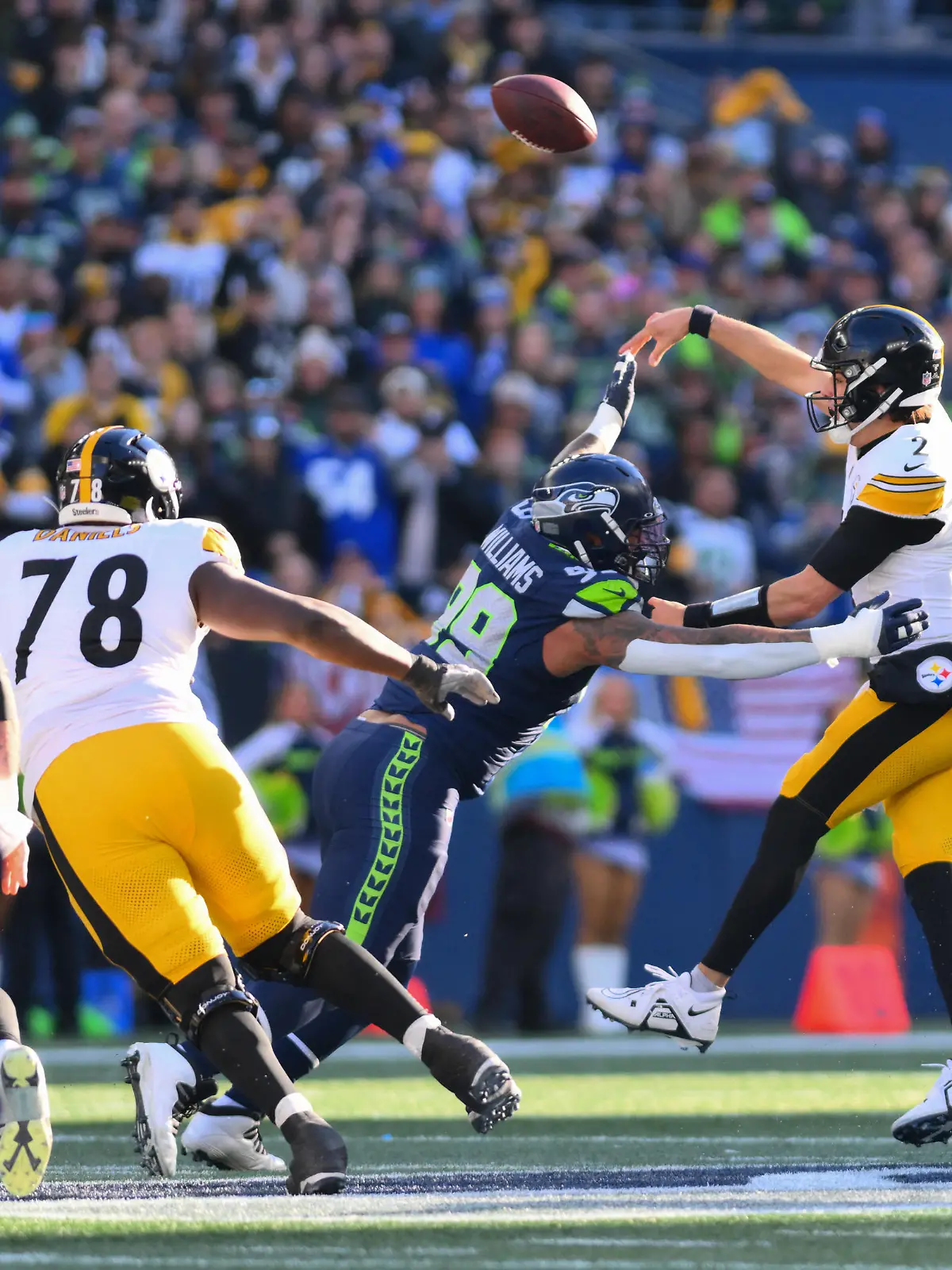 Dec 31, 2023; Seattle, Washington, USA; Pittsburgh Steelers quarterback Mason Rudolph (2) passes the ball over Seattle Seahawks defensive end Leonard Williams (99) during the first half at Lumen Field. Mandatory Credit: Steven Bisig-USA TODAY Sports