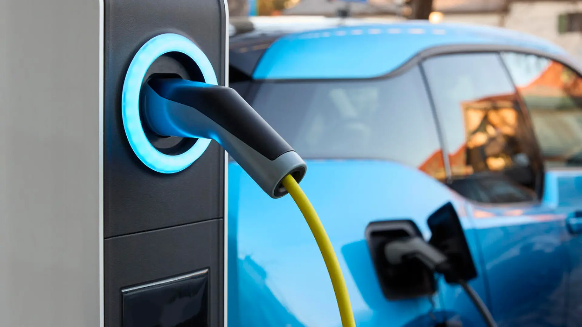 Full frame daylight image with focus of a plug-in electric vehicle charging station in Germany