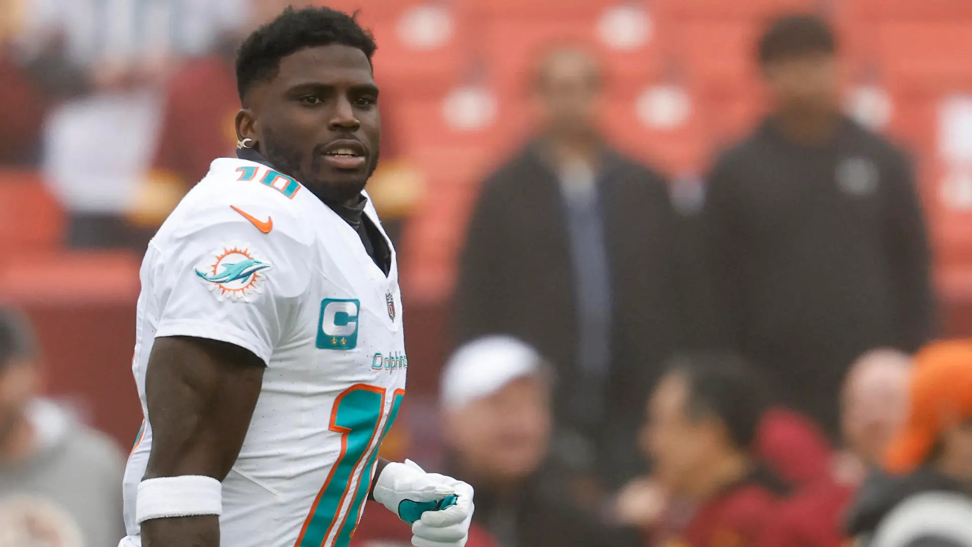 Dec 3, 2023; Landover, Maryland, USA; Miami Dolphins wide receiver Tyreek Hill (10) stands on the field during warm up prior to the game against the Washington Commanders at FedExField. Mandatory Credit: Geoff Burke-USA TODAY Sports