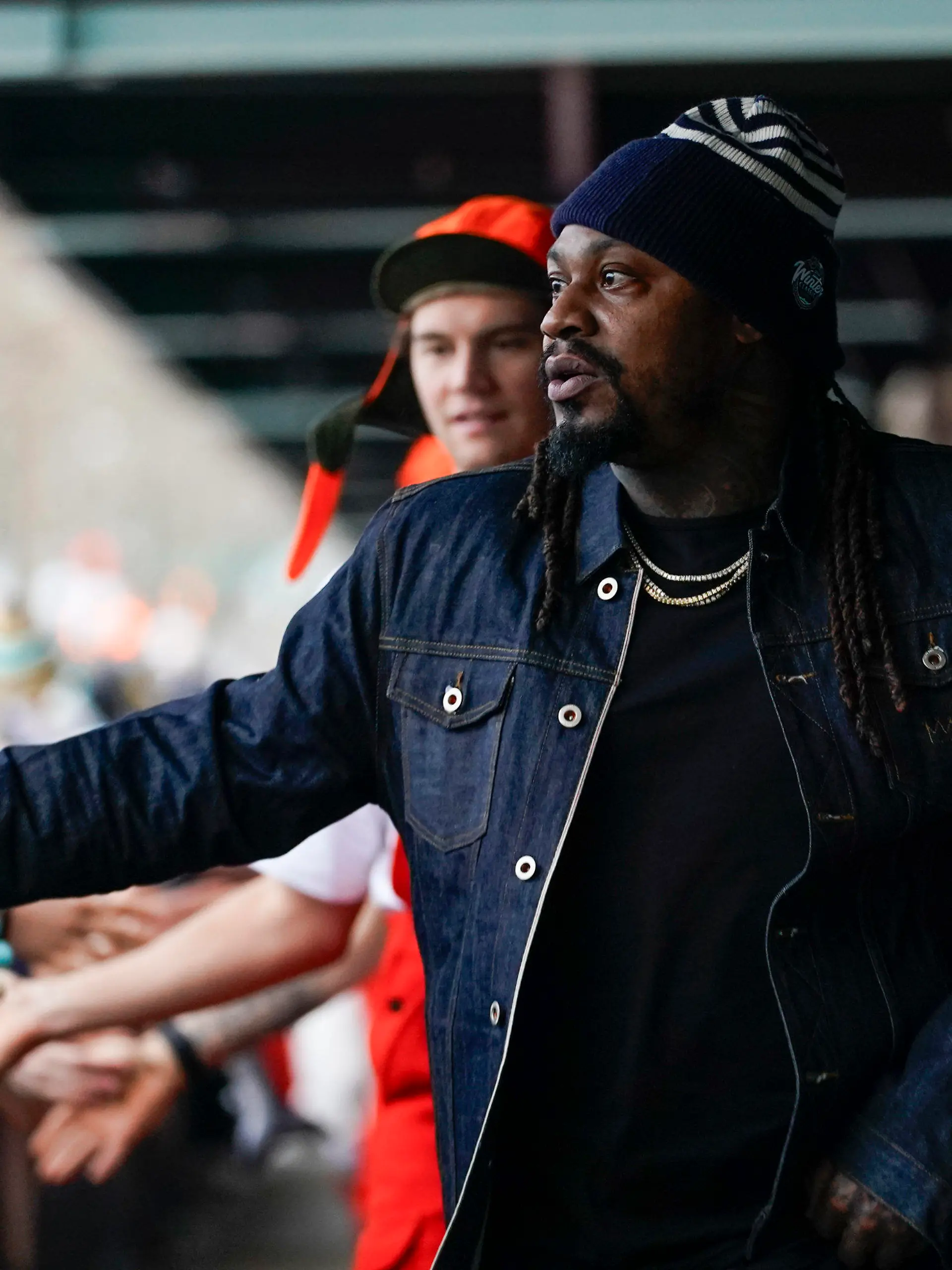 Former Seattle Seahawks running back Marshawn Lynch greets fans as he arrivers with the Seattle Kraken before the NHL Winter Classic hockey game against the Vegas Golden Knights, Monday, Jan. 1, 2024, in Seattle. (AP Photo/Lindsey Wasson)