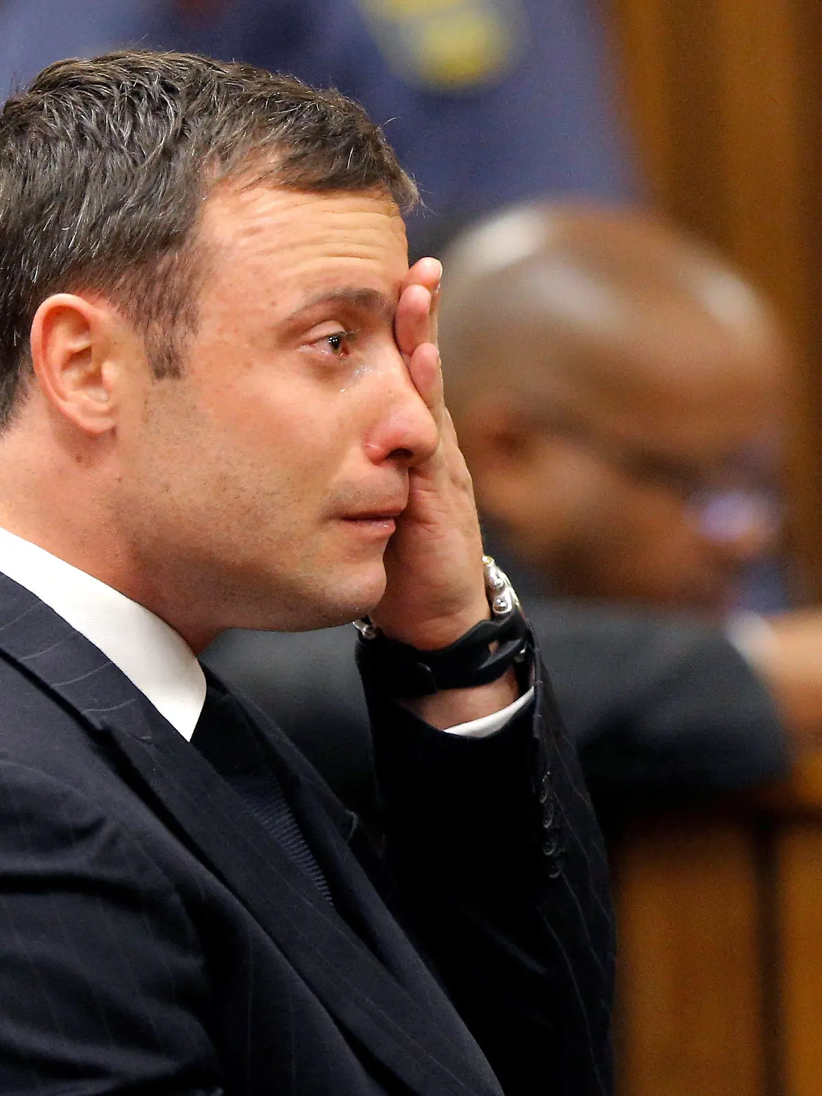 FILE PHOTO: Olympic and Paralympic track star Oscar Pistorius reacts as he listens to Judge Thokozile Masipa's judgement at the North Gauteng High Court in Pretoria, September 11, 2014. Masipa said on Thursday there was "some doubt" a woman screamed on the night when Pistorius shot dead his girlfriend Reeva Steenkamp last year because of contradictory witness testimony.  REUTERS/Kim Ludbrook/Pool/File Photo