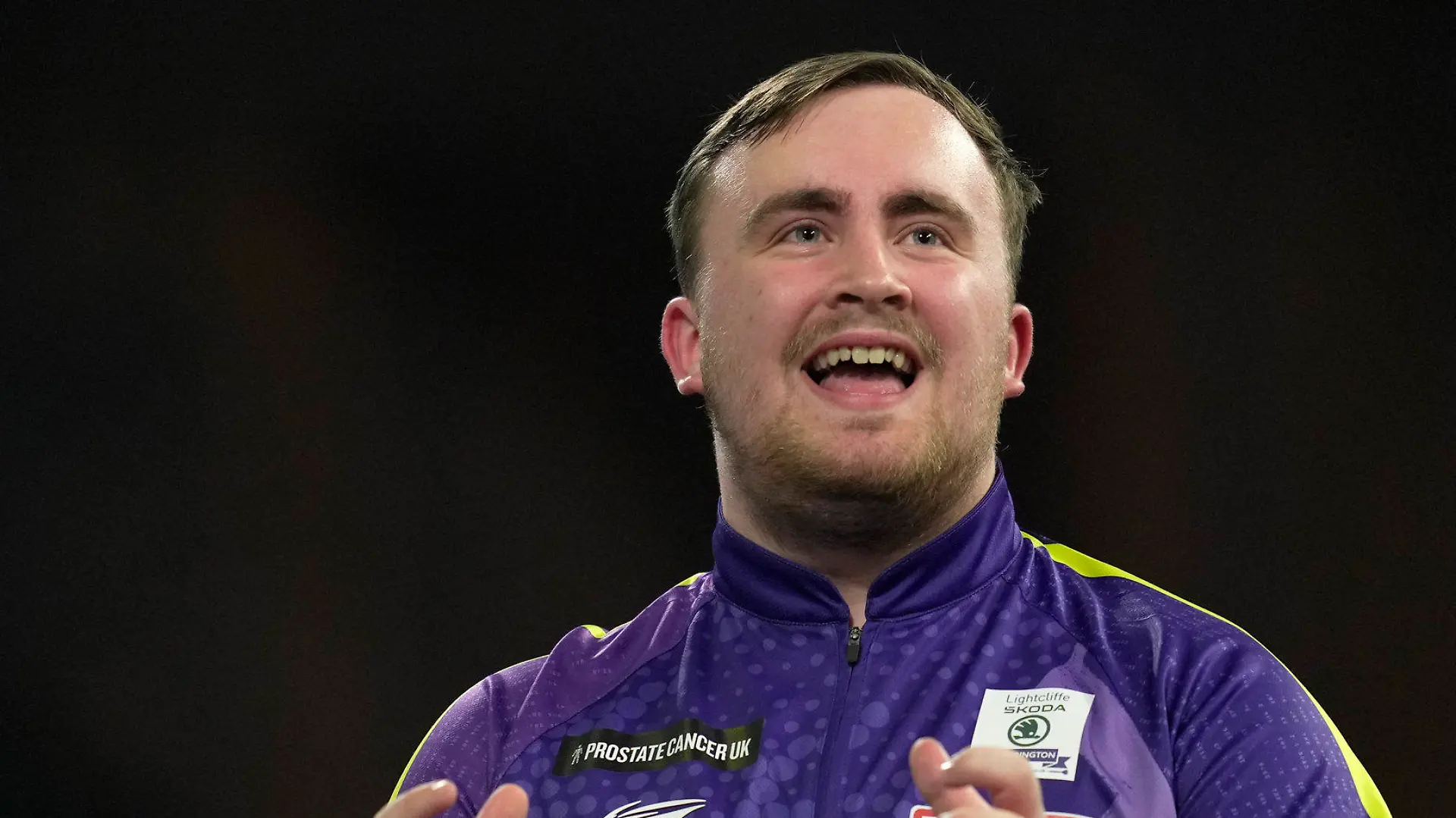 Luke Littler gestures during the final match against Luke Humphries of England at the World Darts Championship, in London, Wednesday, Jan. 3, 2024. (AP Photo/Kin Cheung)